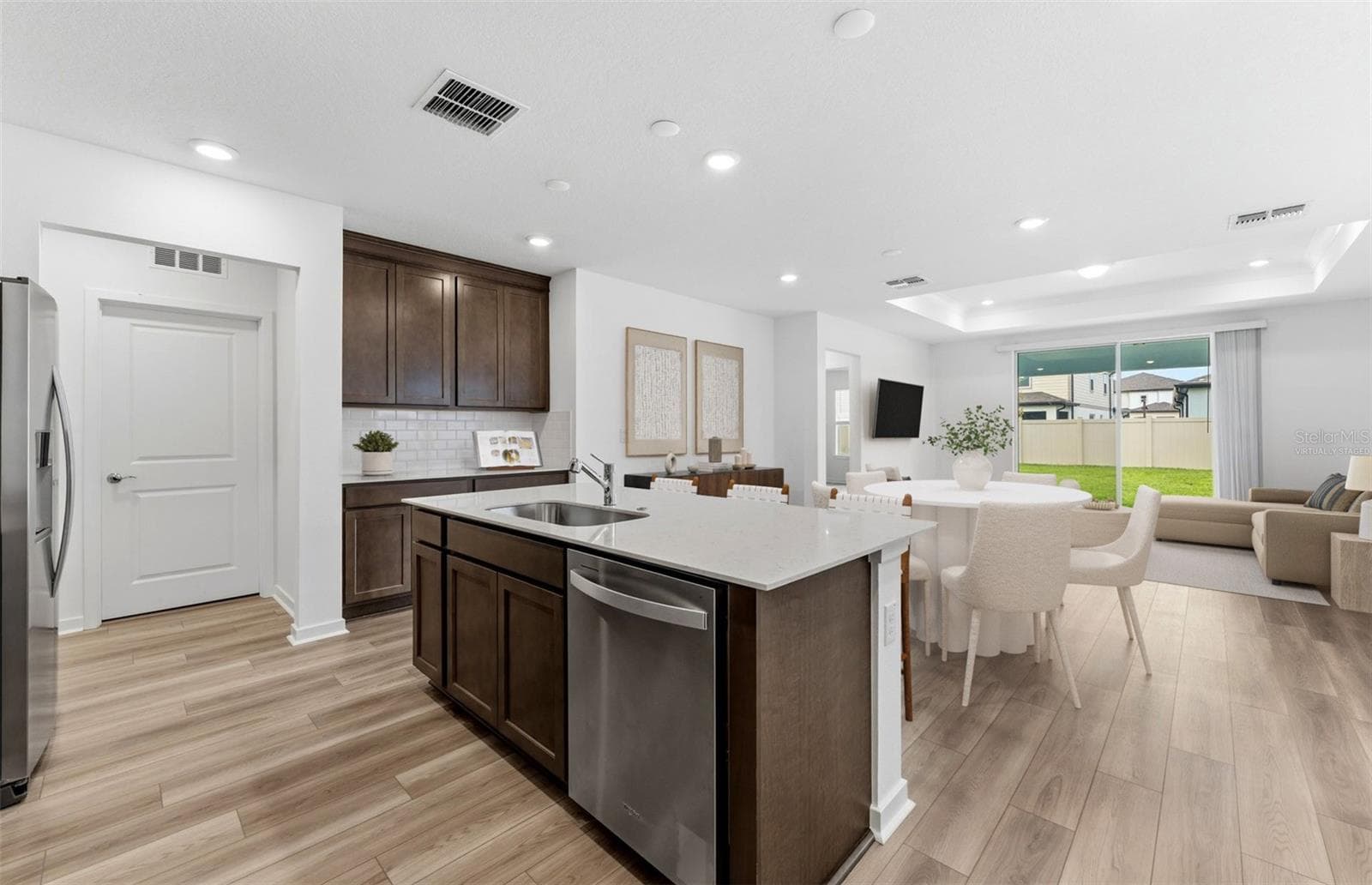 Virtually Staged - Open Kitchen to Cafe to Gathering Room - 33452 BINDING TIES LN, WESLEY CHAPEL
