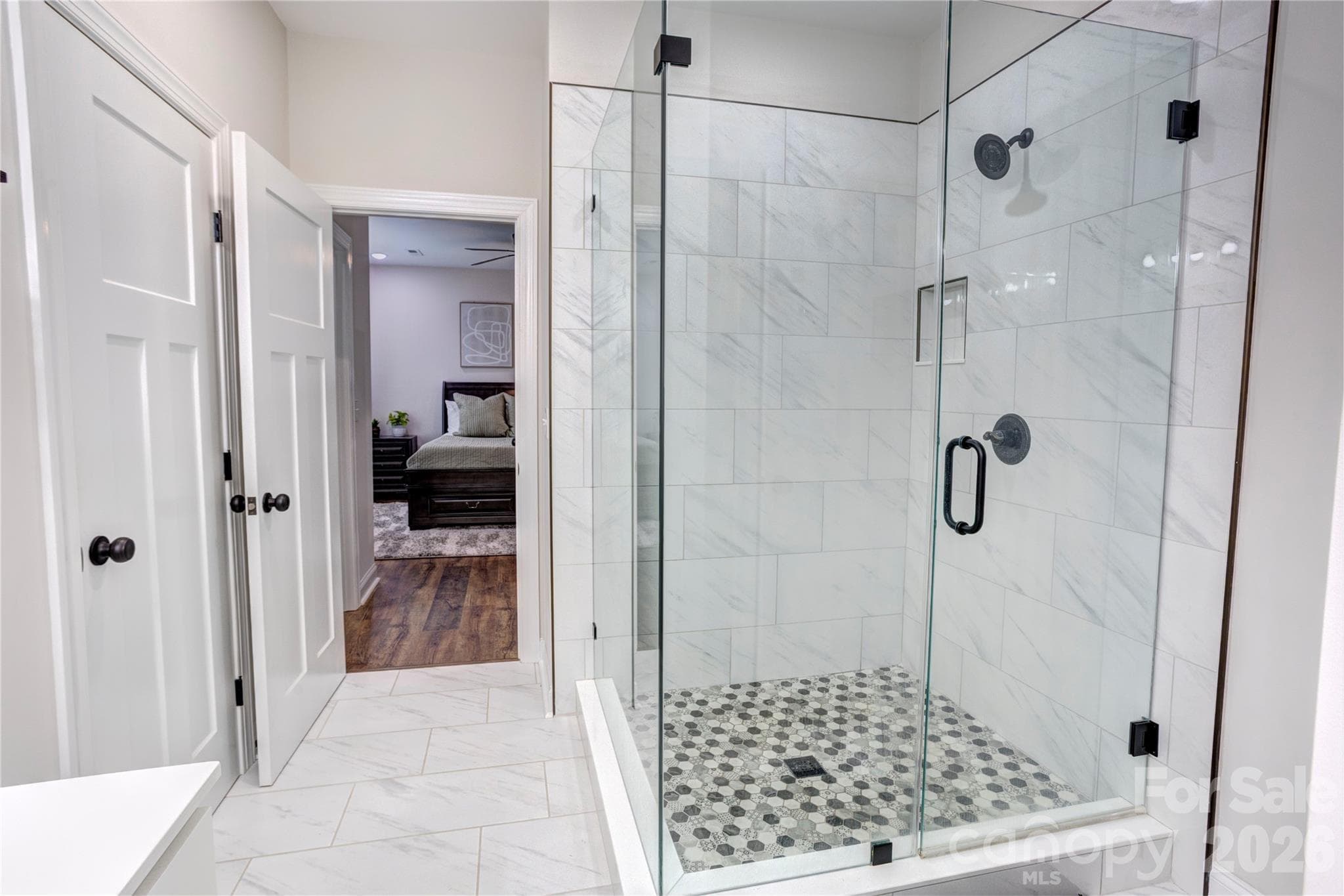 Walk in shower in primary bathroom with unique tile! - 317 Oak Brook Drive, Salisbury