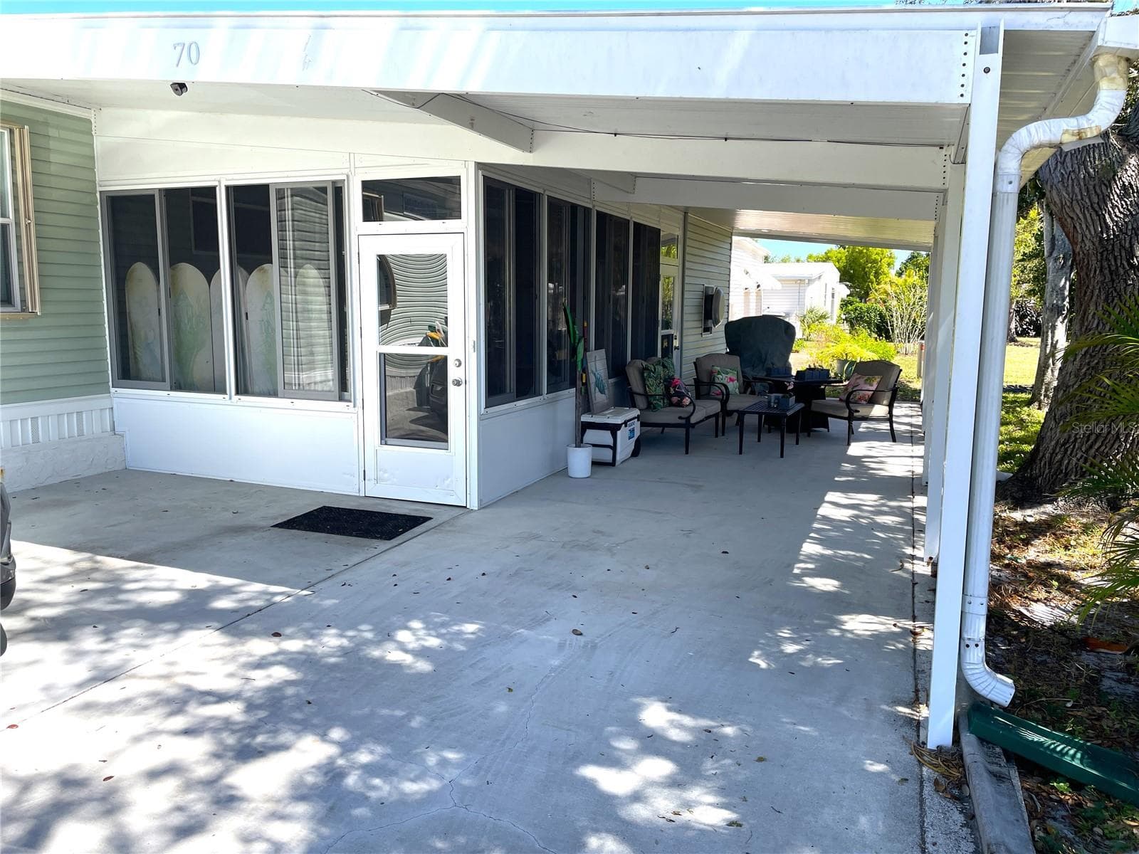 Additional under roof area beyond the seating area - 24437 HARBORVIEW RD #70, PORT CHARLOTTE