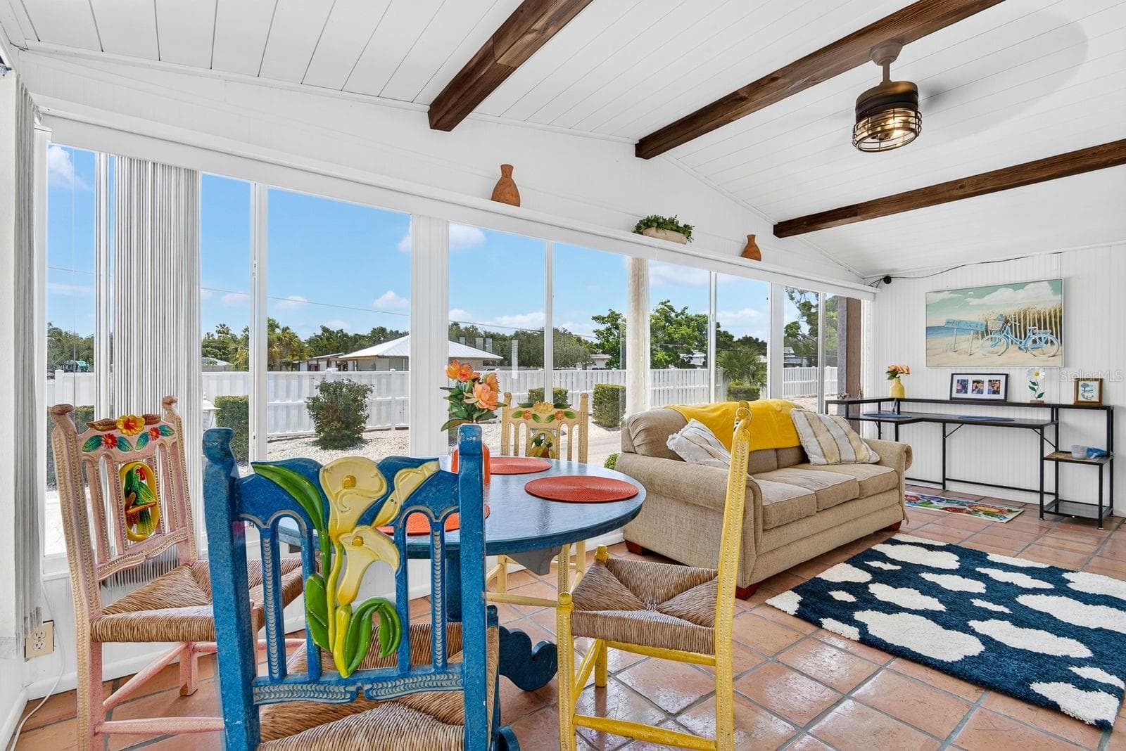 Bright front lanai featuring gorgeous tile and wood beams for decor - 2107 PALMA SOLA BLVD #17, BRADENTON