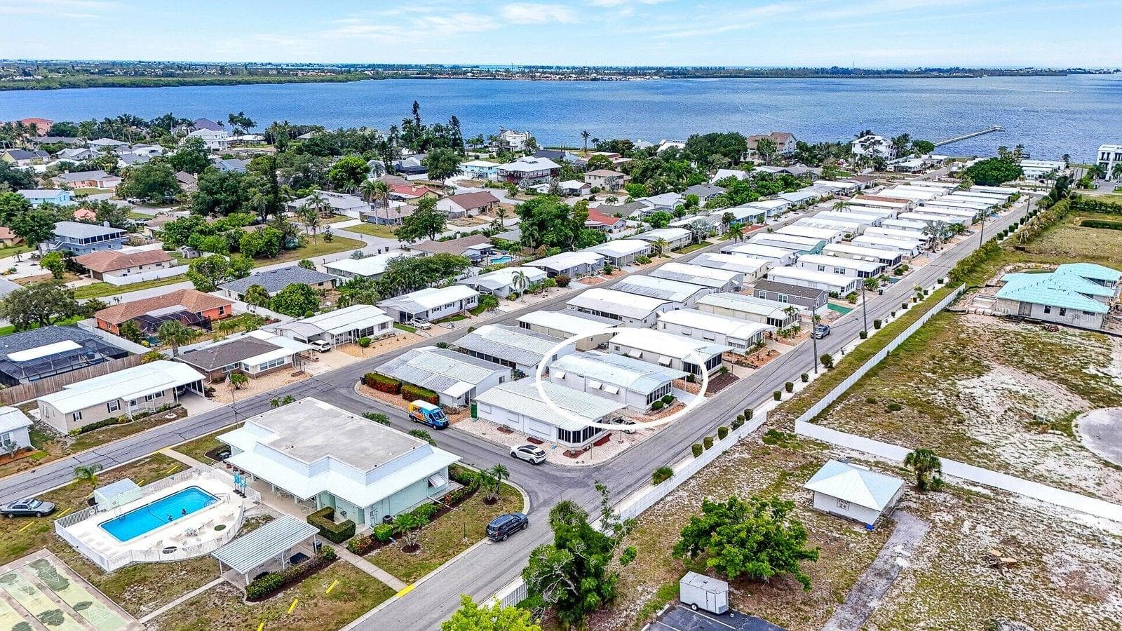 Another view showing lot 17 facing southwest and shows how close it is to clubhouse and pool, just steps away. - 2107 PALMA SOLA BLVD #17, BRADENTON