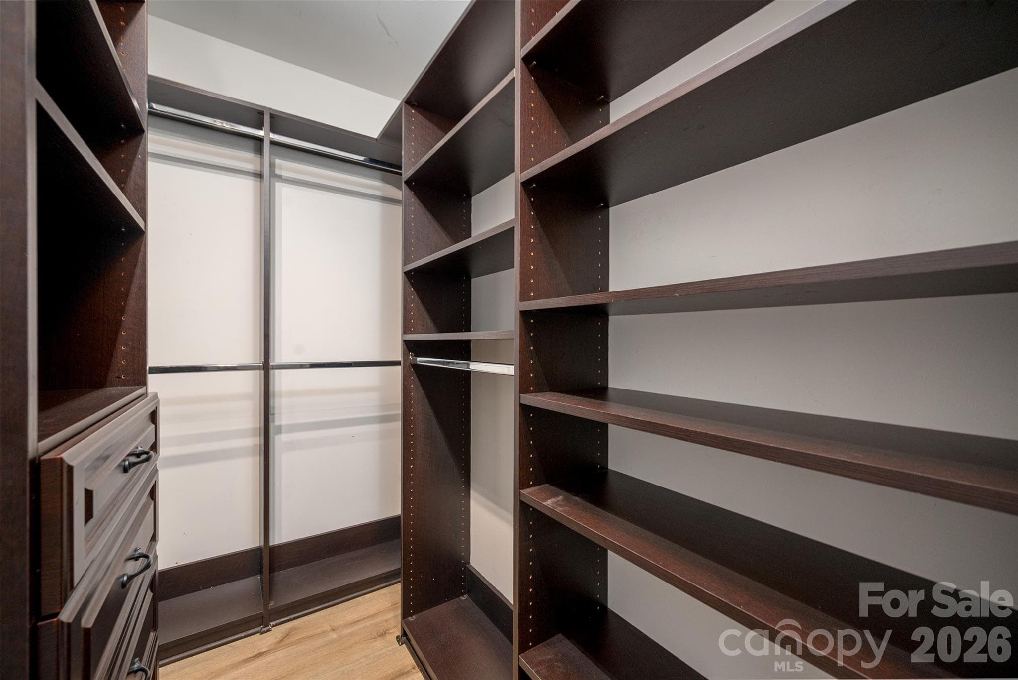 Guest bedroom closet also offers a custom closet system to really help you stay organized. - 4620 Piedmont Row Drive, Charlotte