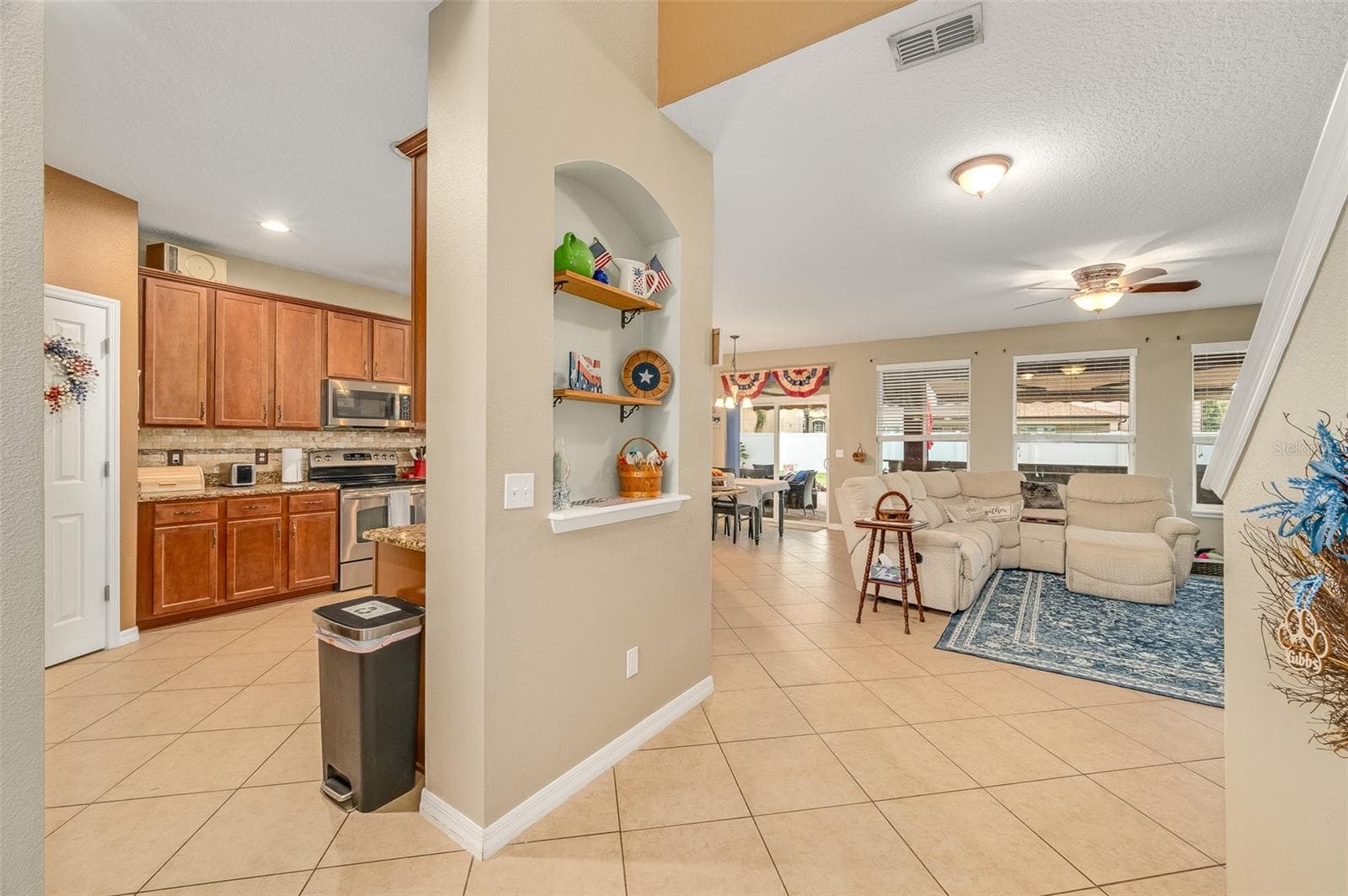 Kitchen to the left, dining nook and living room ahead, stairs to the right - 2711 CYPRESS TREE TRL, ST CLOUD
