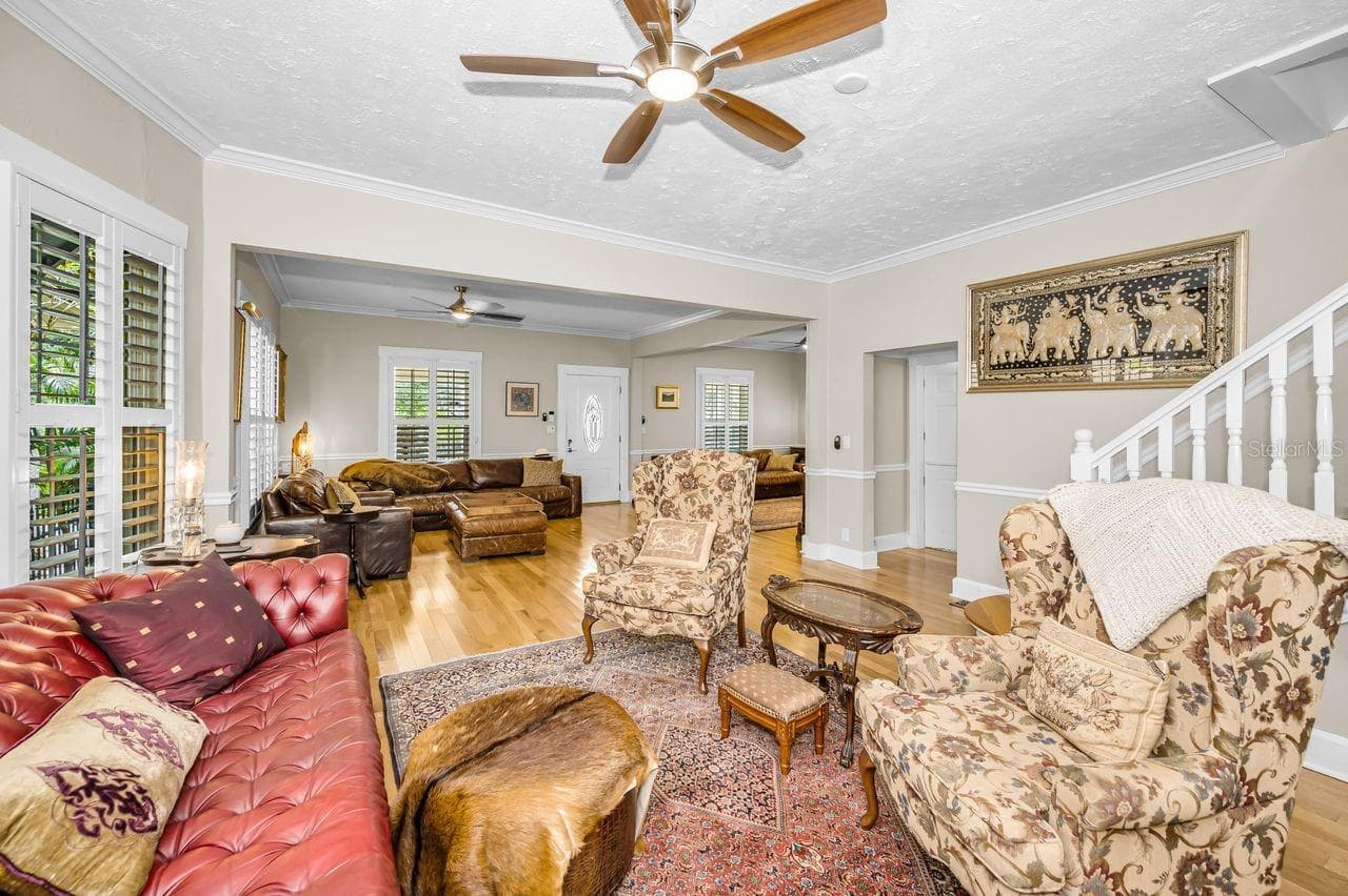 A great room with a wood-burning fireplace — warm, inviting, and full of character. - 732 NE OAK ST, ST PETERSBURG