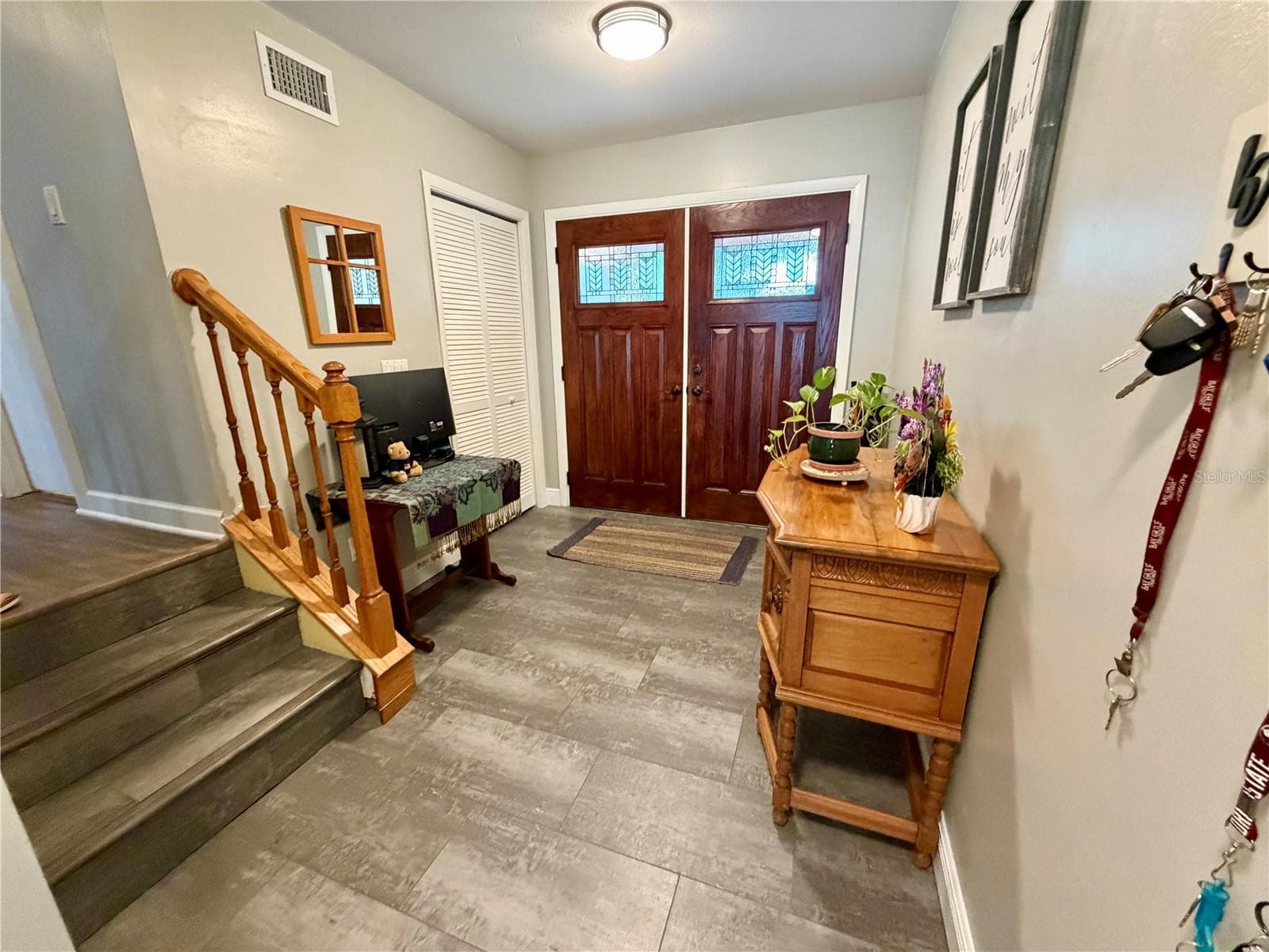 Welcoming front door and foyer with stairs to main living level - 15705 CASHMERE LN, TAMPA