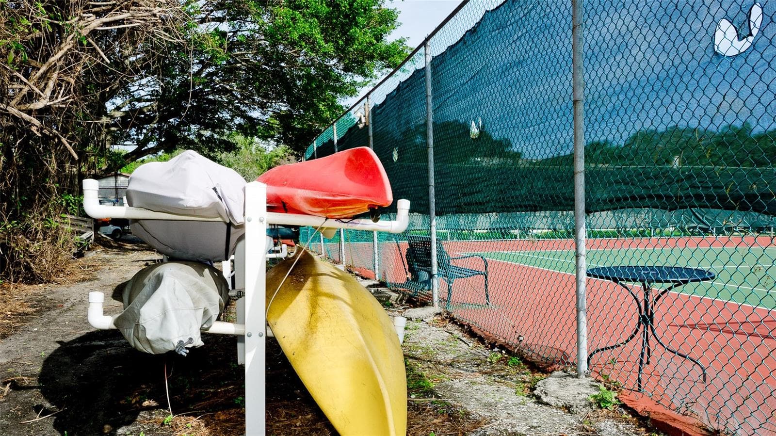 kayak/paddleboard rack next to tennis court - 507 LAKESIDE DR #507, BRADENTON