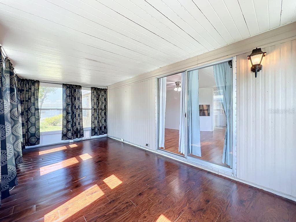 Florida room opens to Living Room - 1203 APACHE CIR, TAVARES