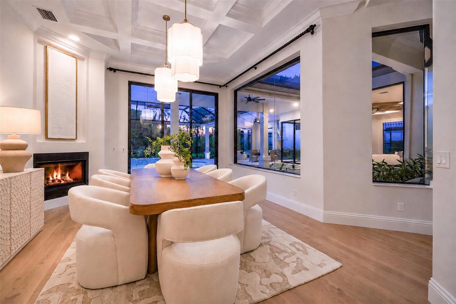 Dining Room, Sliding Glass Doors and Gas Fireplace - 9261 MCDANIEL LN, SARASOTA