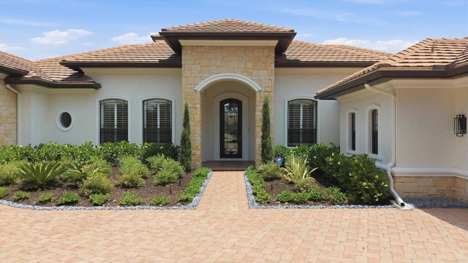 Front Entry has Iron Front Door, New Landscaping and Landscape lighting - 9261 MCDANIEL LN, SARASOTA