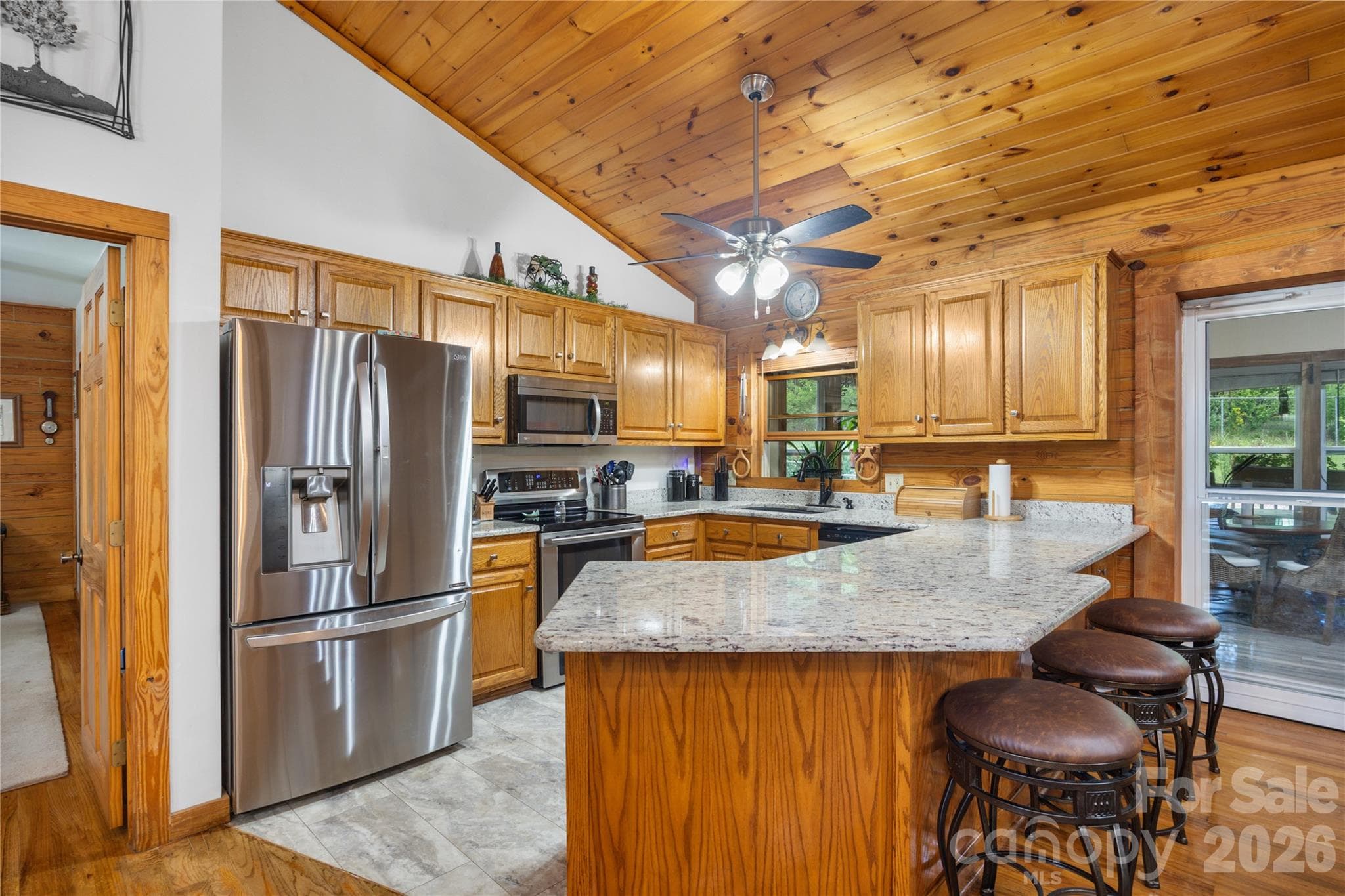 Large kitchen features granite counters, stainless appliances, and storage galore. - 214 Harbor Ridge Drive, Connelly Springs