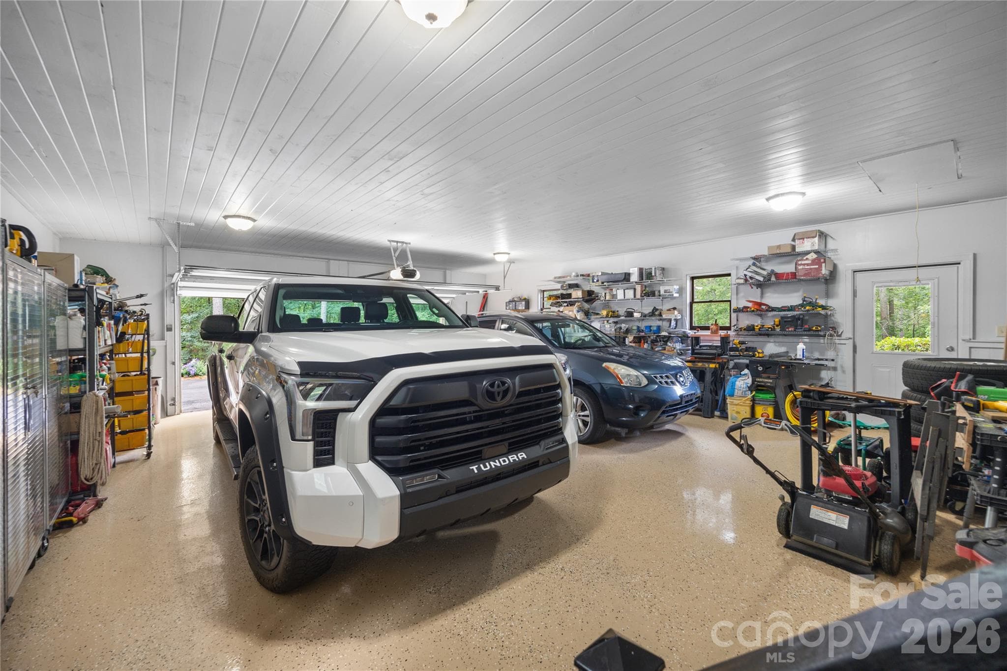 Oversized garage with new epoxy floors. - 214 Harbor Ridge Drive, Connelly Springs
