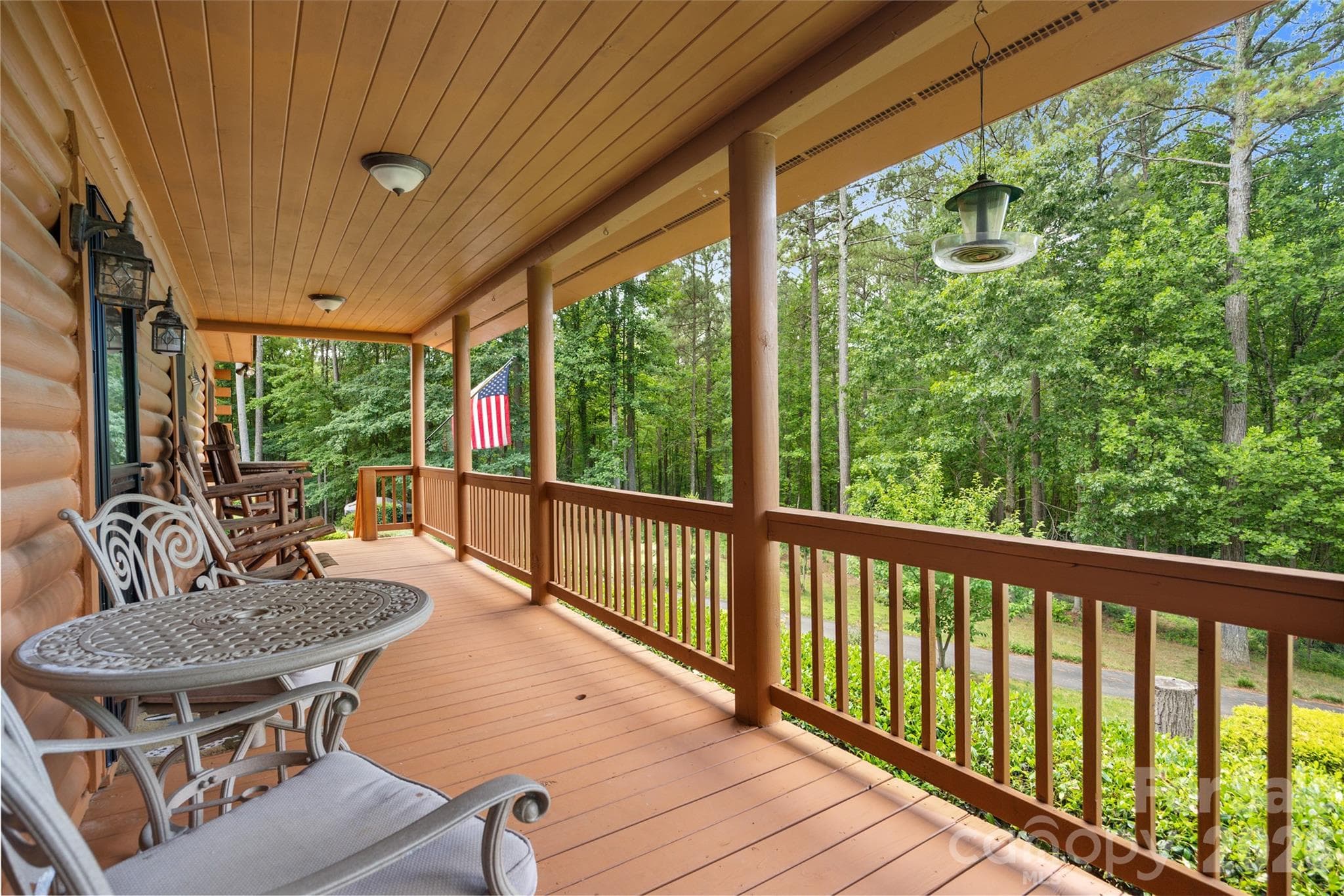 Relax on the rocking chair porch overlooking stunning landscaping. - 214 Harbor Ridge Drive, Connelly Springs