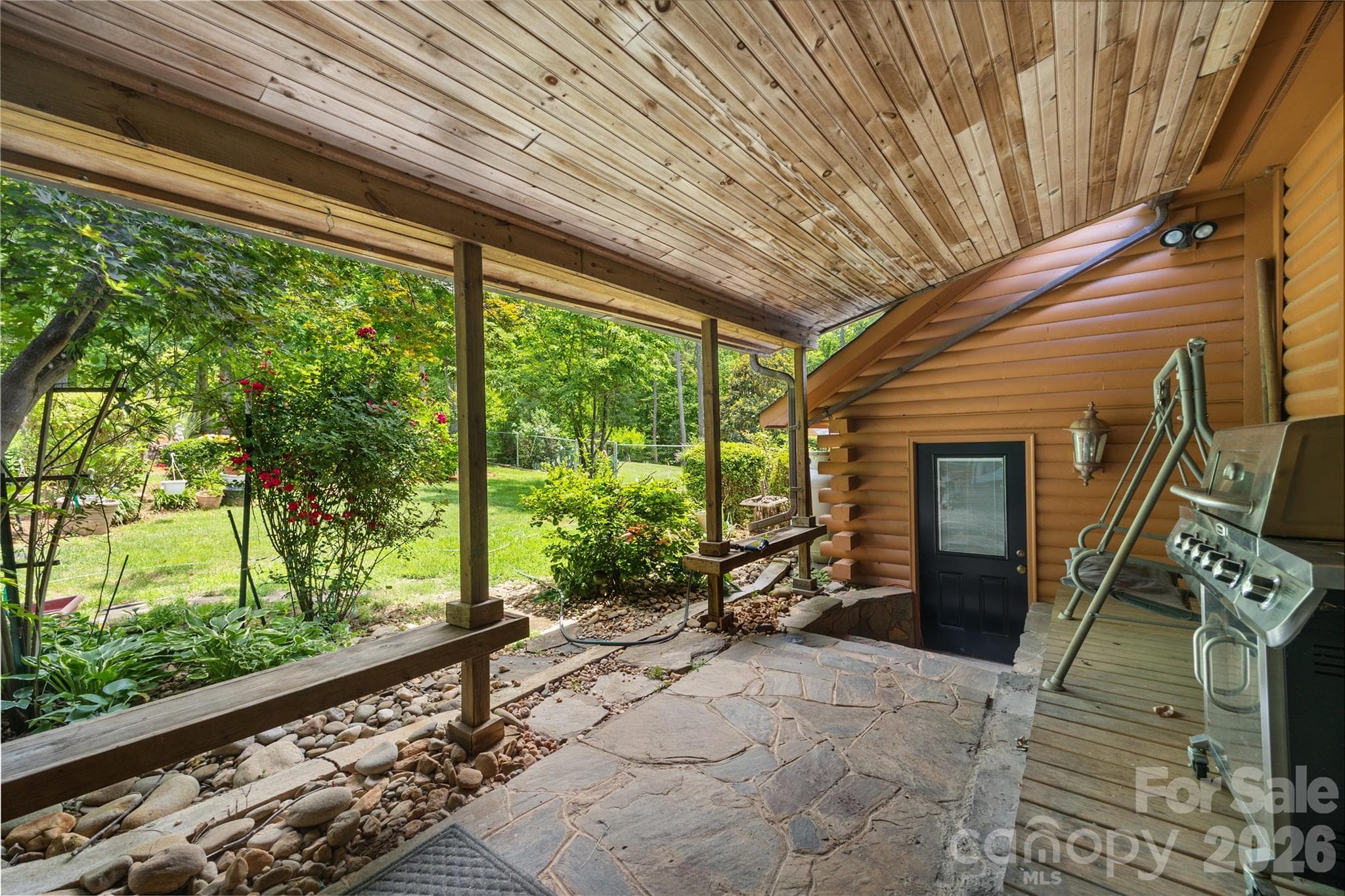 Covered porch from garage to sunroom. - 214 Harbor Ridge Drive, Connelly Springs