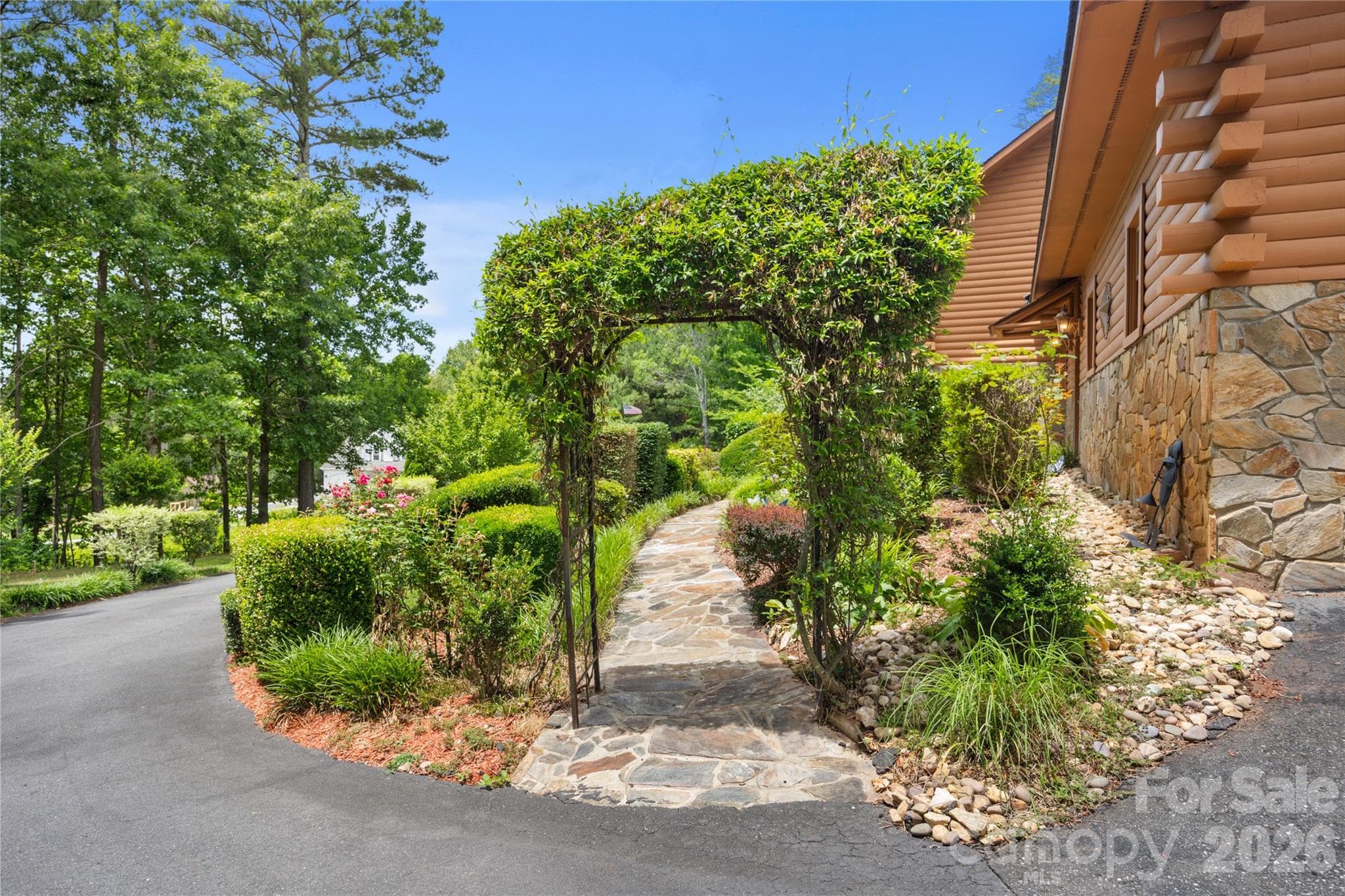 Stunning gardens and landscaping create a truly special setting. - 214 Harbor Ridge Drive, Connelly Springs