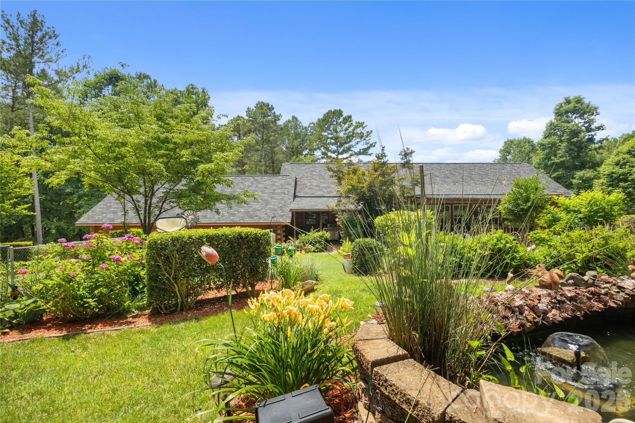 Lush landscaping showcases years of exceptional care and pride - 214 Harbor Ridge Drive, Connelly Springs