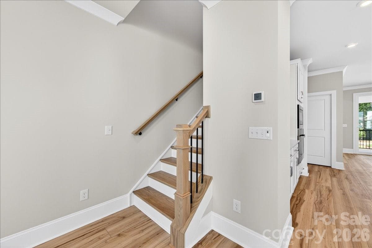 Oak box stairs with open rails to the third floor - 12015 Elsa Lane, Charlotte