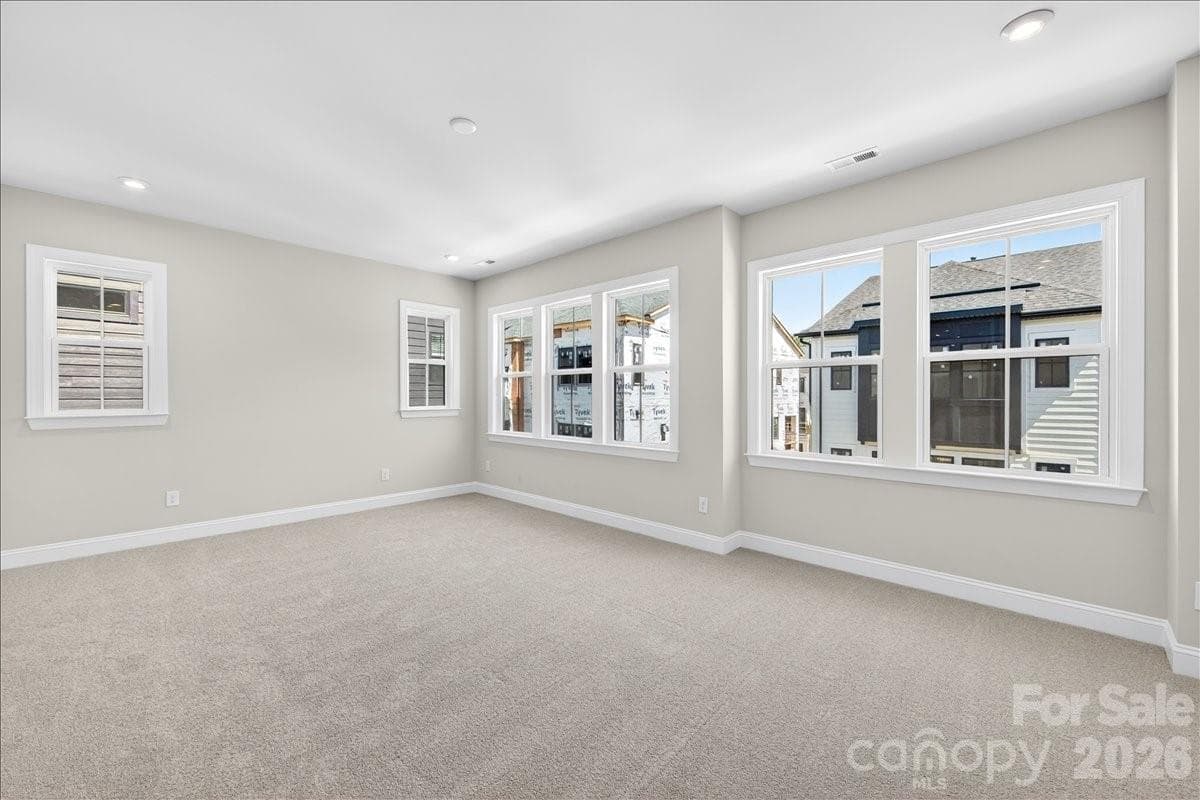 Primary Bedroom with ample windows for natural light - 12015 Elsa Lane, Charlotte