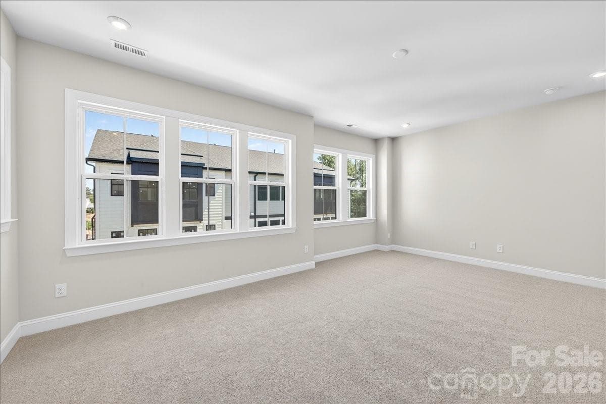 Primary Bedroom with ample windows for natural light - 12015 Elsa Lane, Charlotte