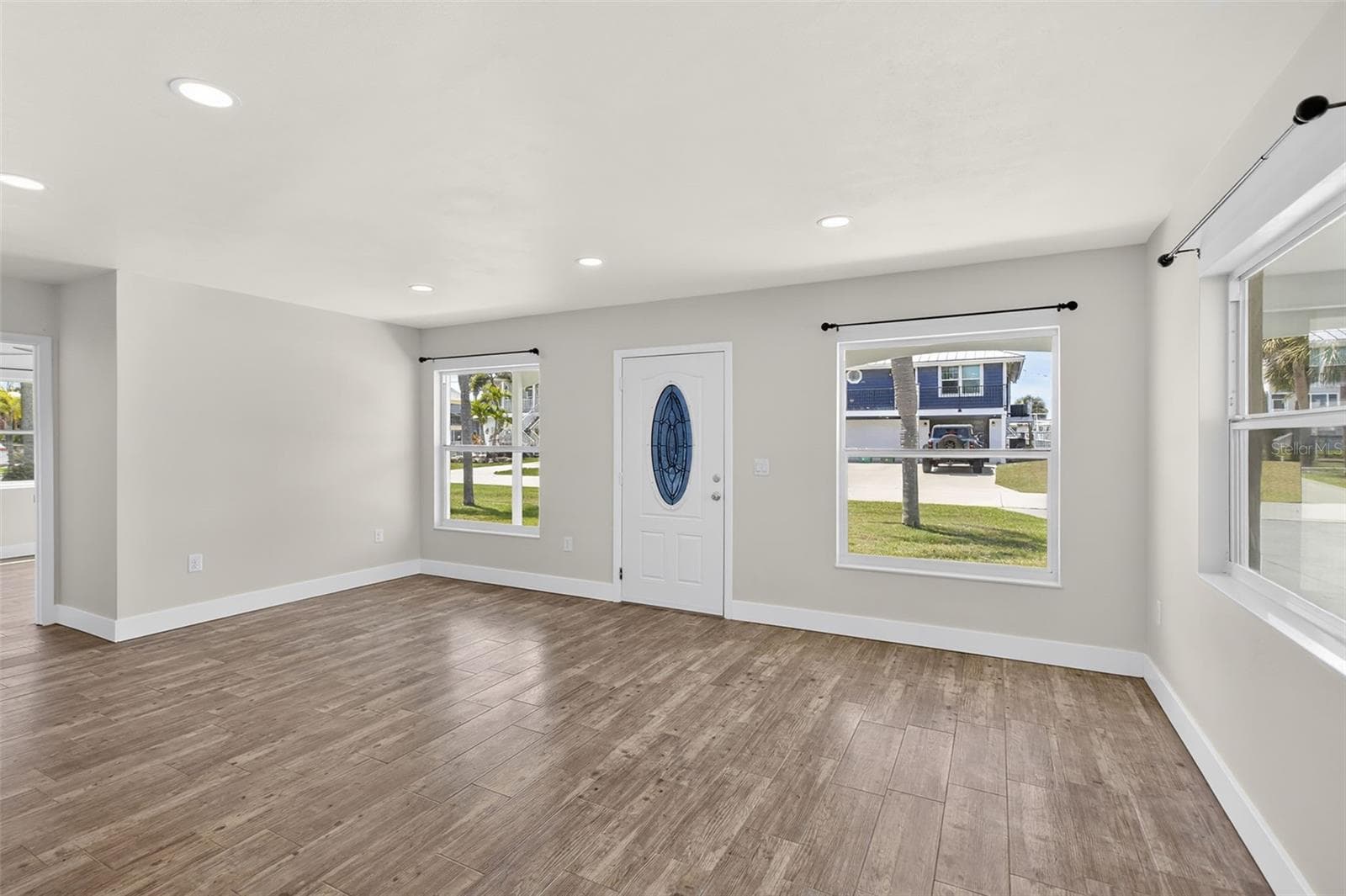 View from kitchen to the front entry. - 10451 MARION ST, ENGLEWOOD