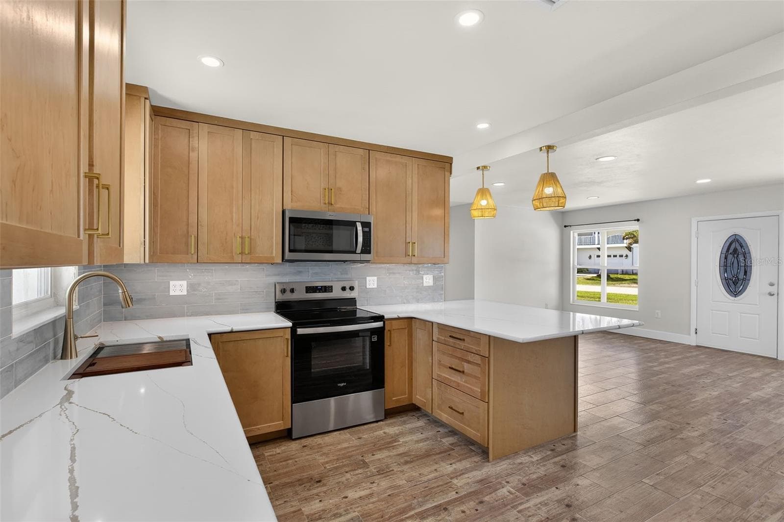 View of kitchen and living area from bathroom near Florida room - 10451 MARION ST, ENGLEWOOD