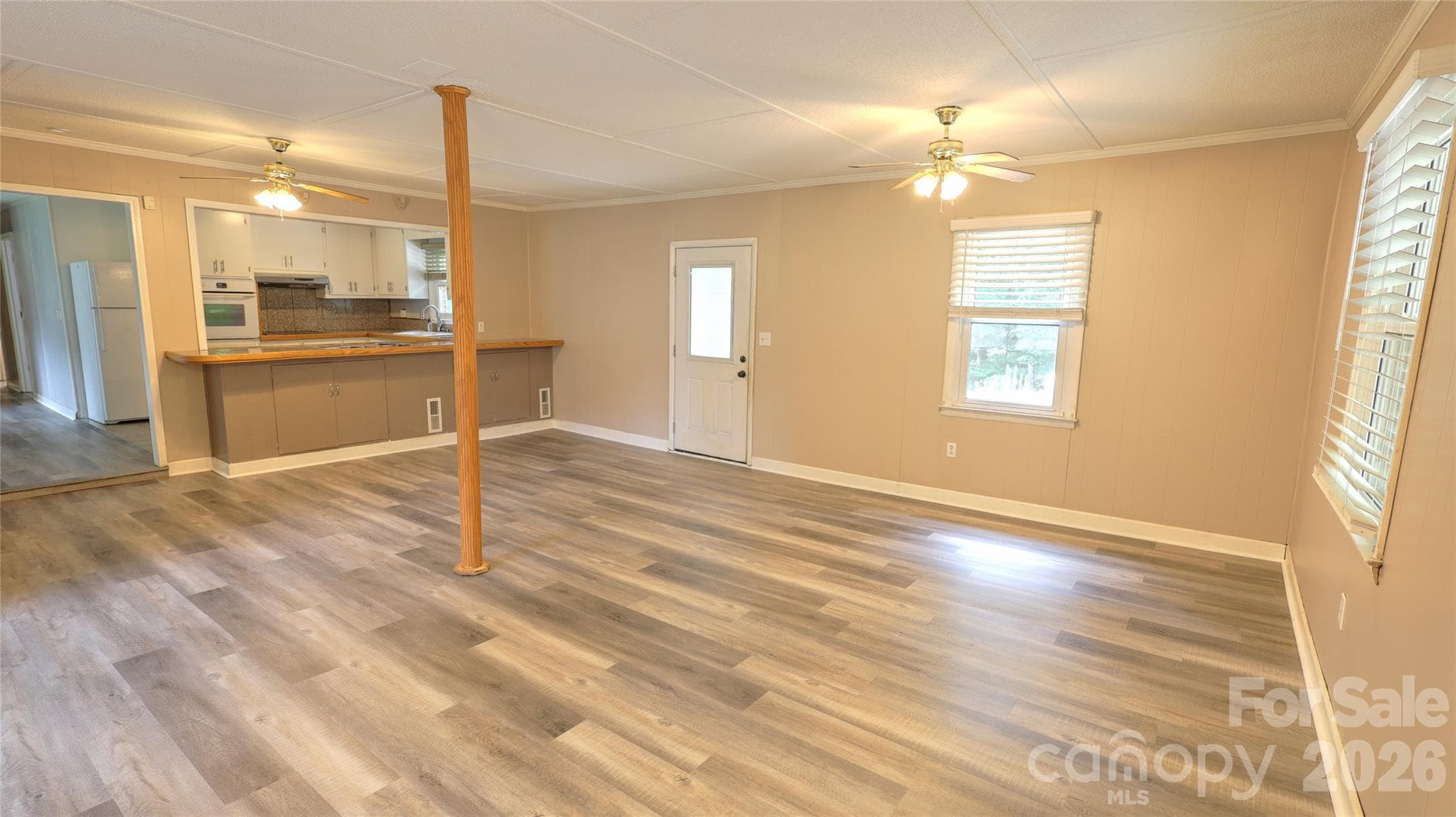 Brand new LVP flooring in large great room open to kitchen and dining room - 1130 Allman Extension, Mount Pleasant