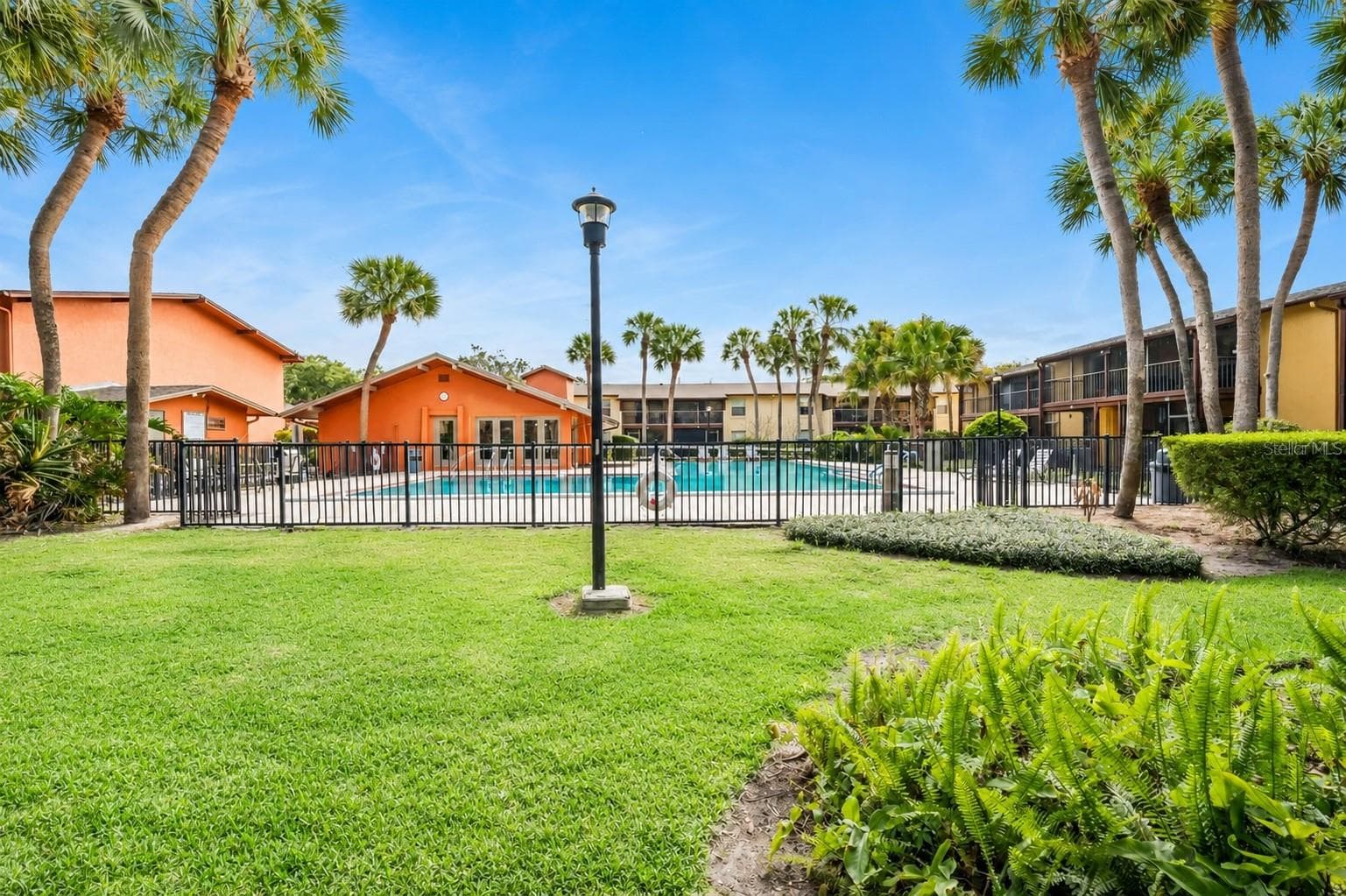 Community pool right outside your screened in patio. - 754 E MICHIGAN ST #185, ORLANDO