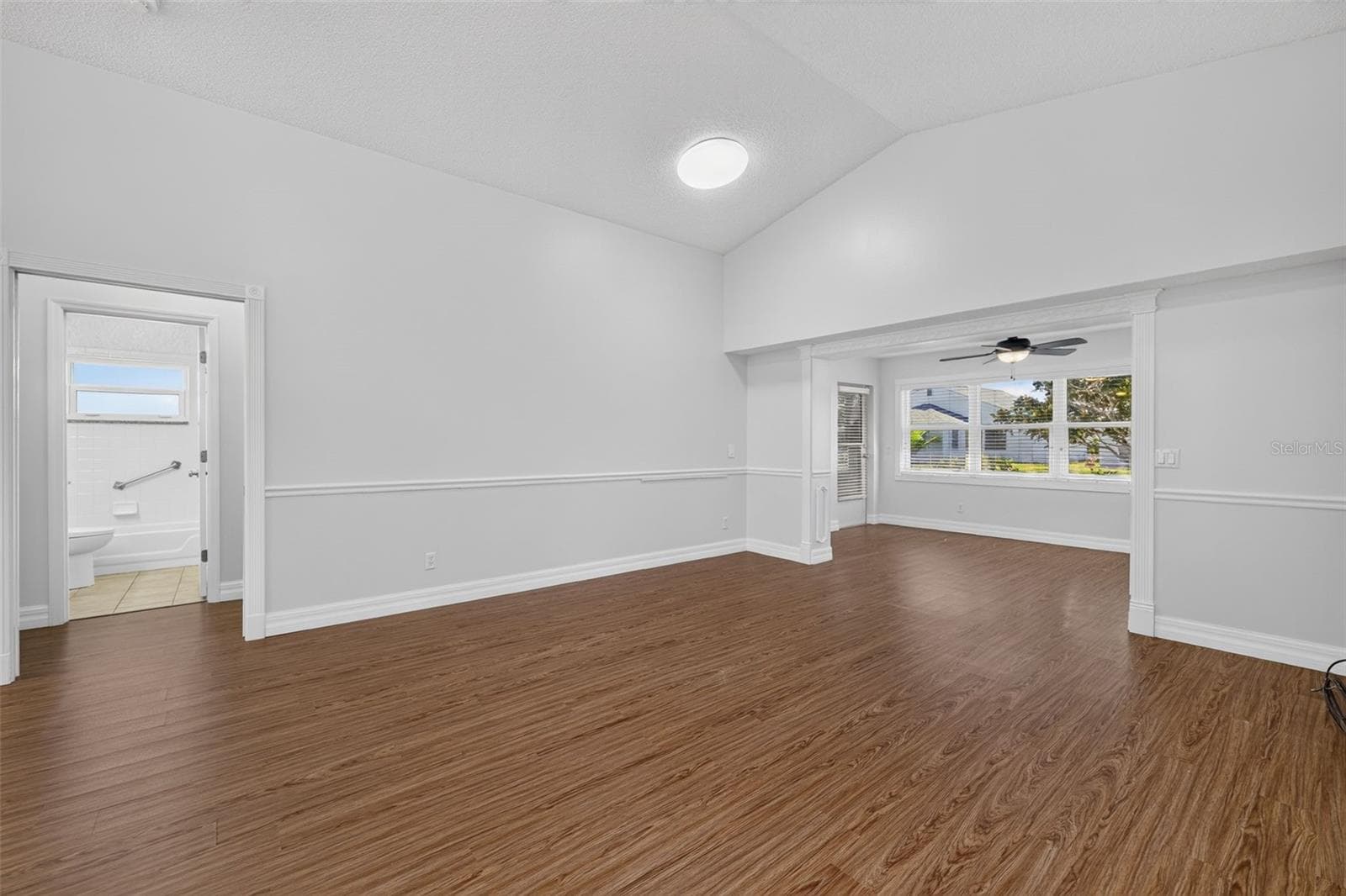 Living Room with pocket door to Guest Wing - 4431 FERN DR, BRADENTON