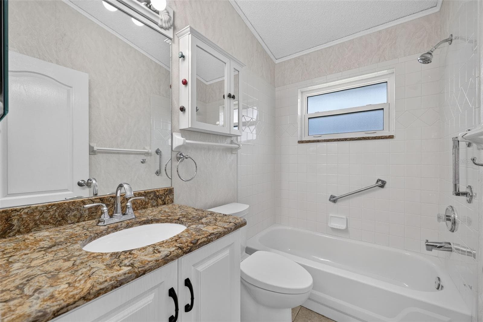 Guest Bath with Linen Closet in Hallway - 4431 FERN DR, BRADENTON
