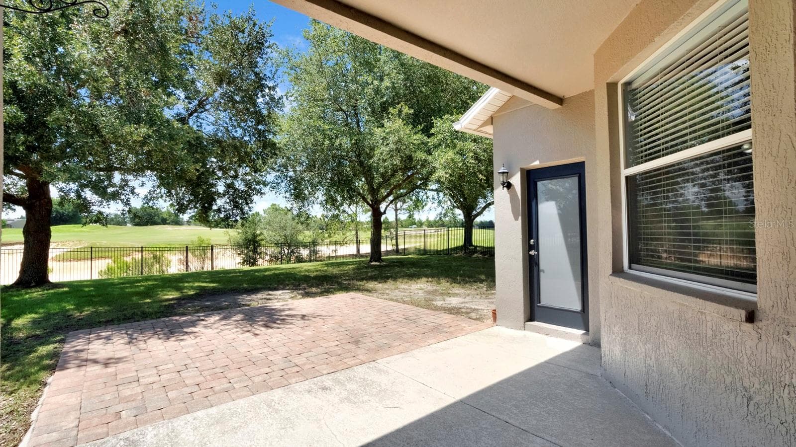 Back of home. Covered Patio w/extended Paver Area - 34037 FORTUNADO ST, SORRENTO