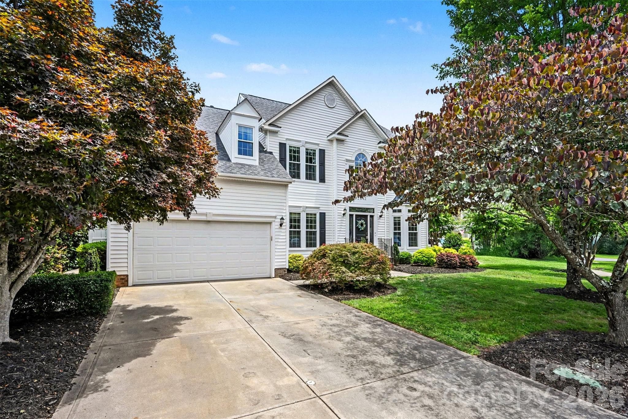 Tons of mature landscaping with this home! Beautiful Japanese maple as you walk to the front door! - 2442 Smith Cove Road, Denver
