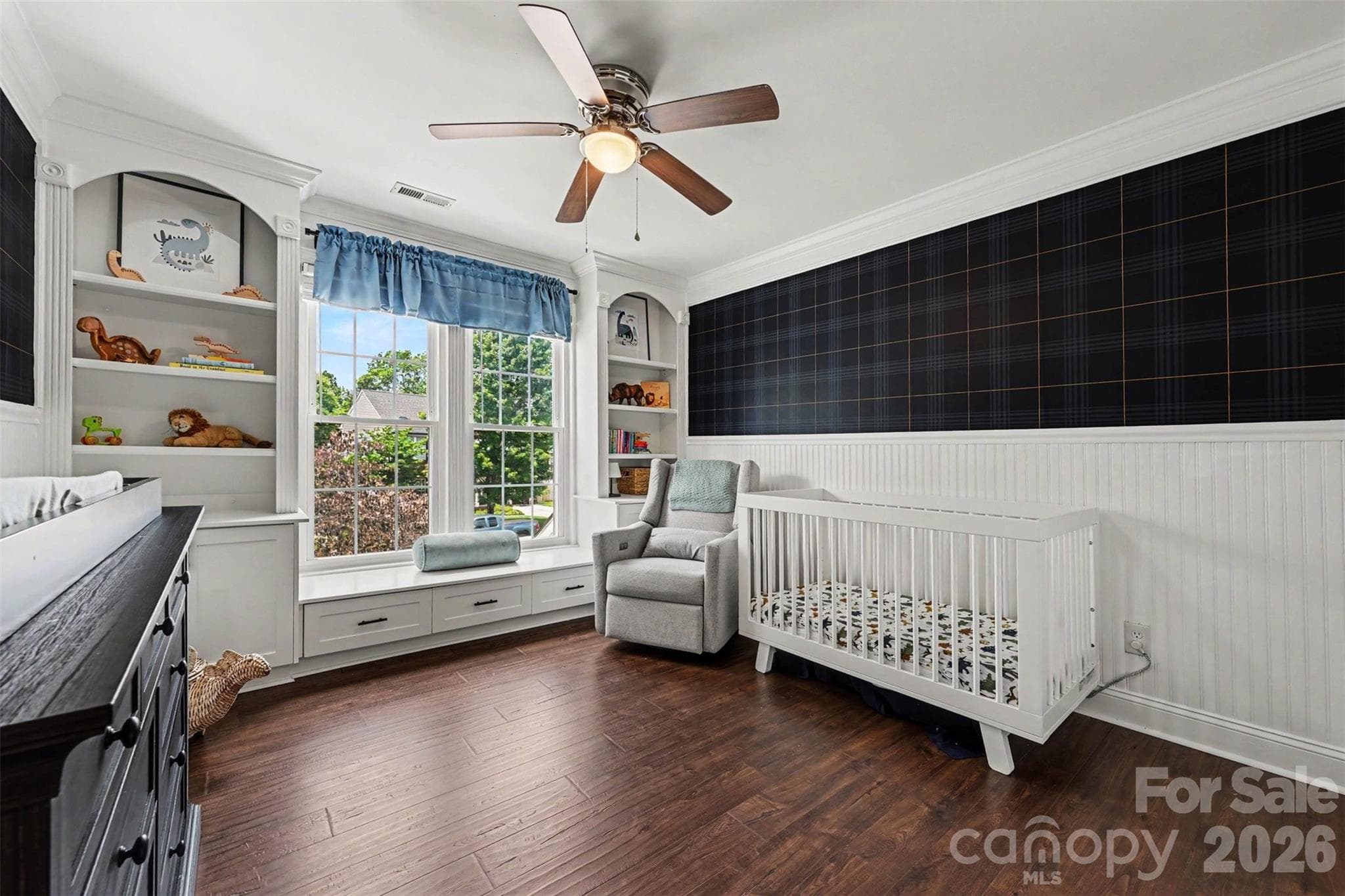 Upper bedroom with built in cabinetry and window bench. - 2442 Smith Cove Road, Denver