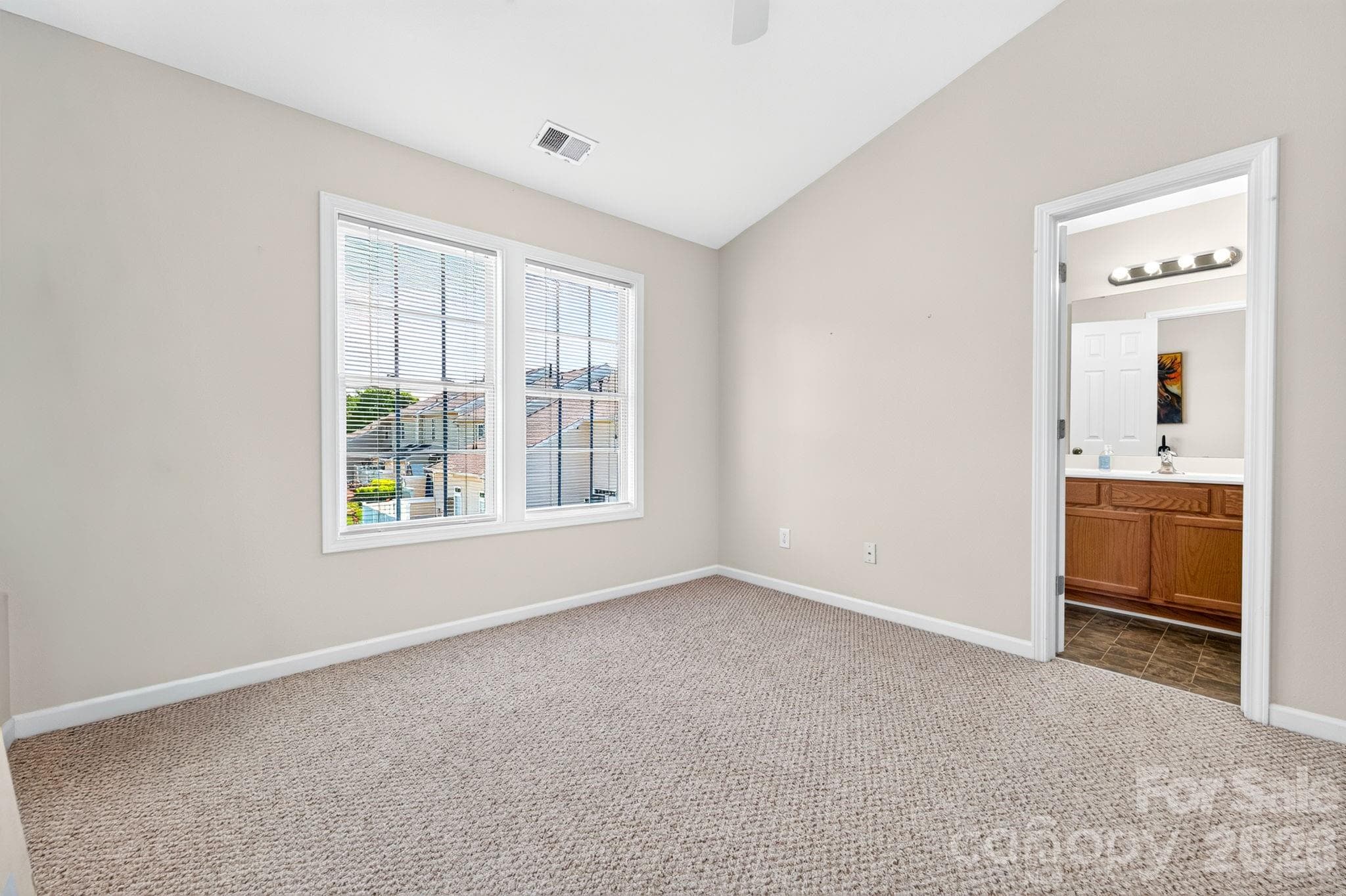 Second bedroom with vaulted ceiling and ceiling fan - 6312 Rhodins Lane, Indian Land