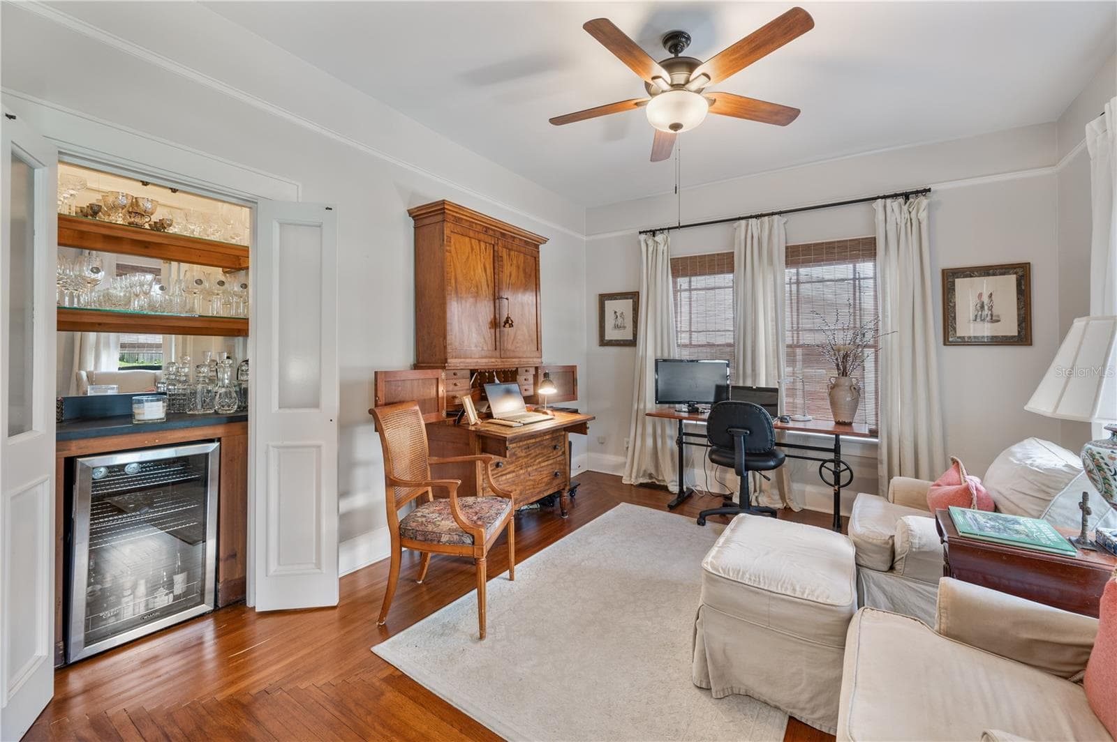 Sitting room/den off the living room. Dry bar with wine refrigerator and french doors - 1102 MELTON AVE, LAKELAND