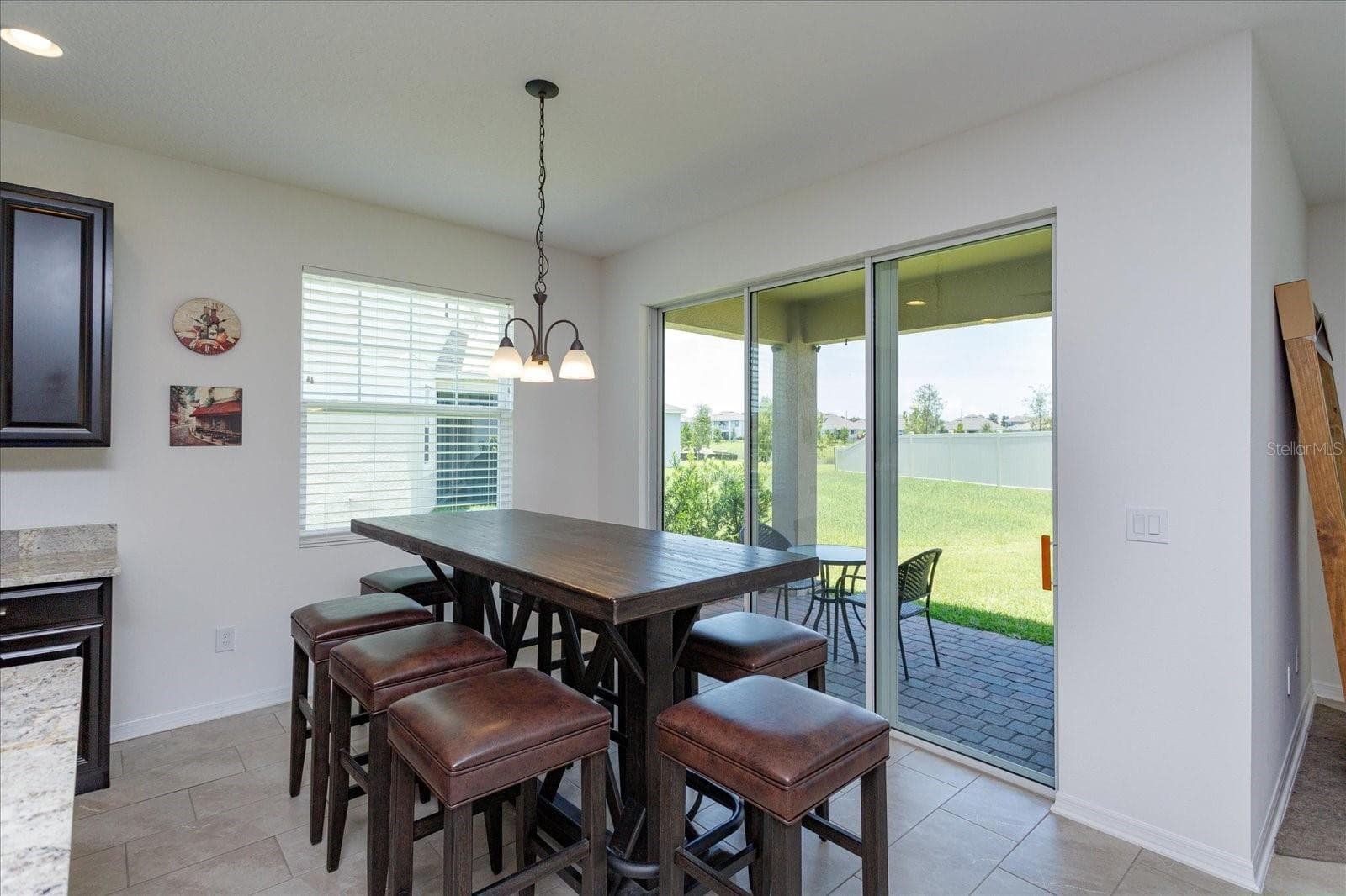 Eat In Area in kitchen looking onto the covered and screened lanai - 16707 SANCTUARY DR, WINTER GARDEN
