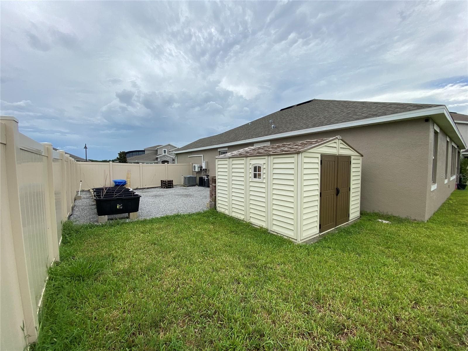 Side yard with Raised Garden and shed - 16707 SANCTUARY DR, WINTER GARDEN