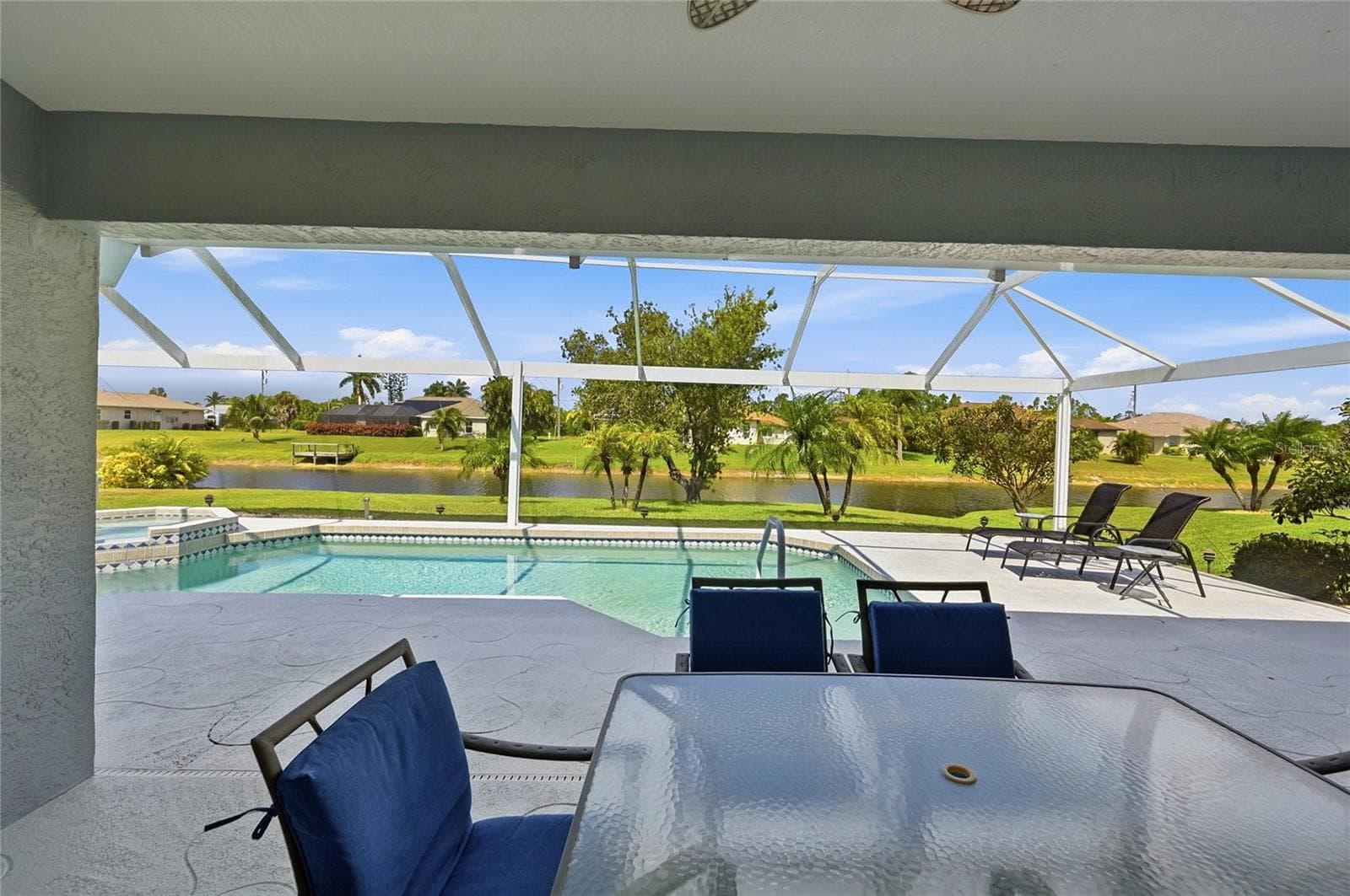 Lanai View of rear Yard to Canal - 816 BOUNDARY BLVD, ROTONDA WEST
