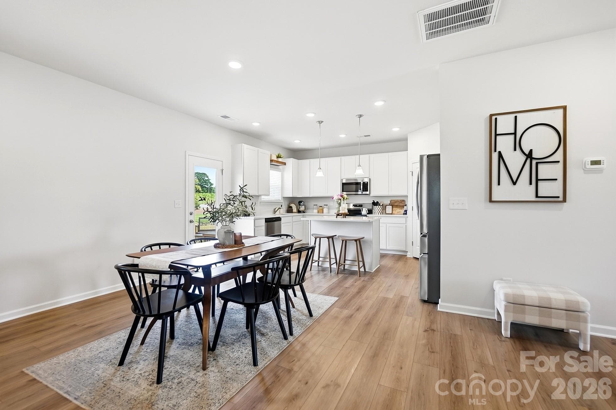 Seamless flow between the dining area, kitchen, and living room. - 6023 Busch Way, Midland