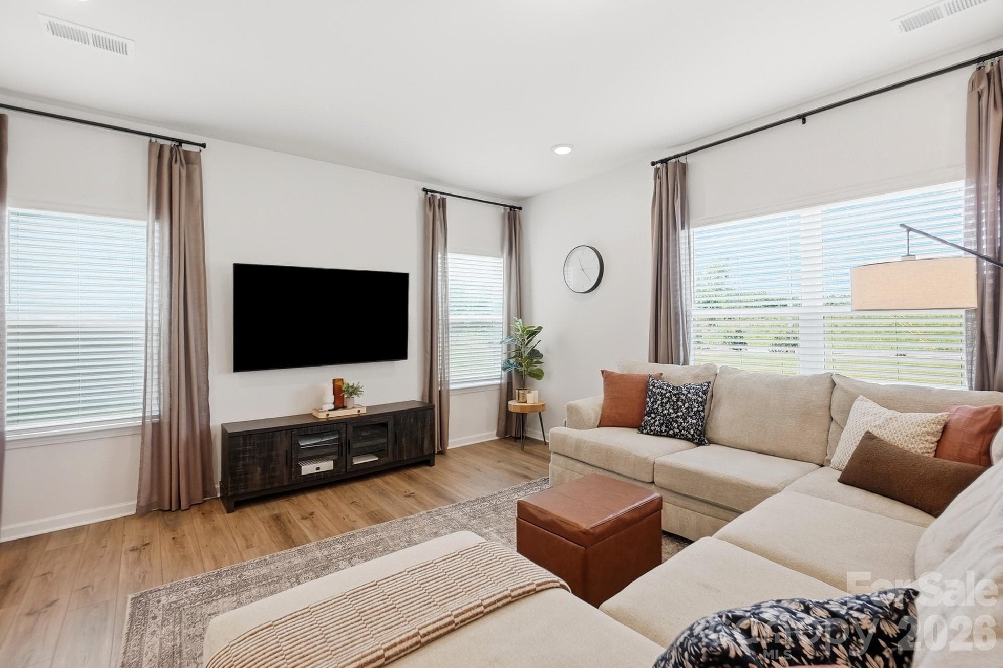 Large windows bring plenty of natural light into the living room. - 6023 Busch Way, Midland