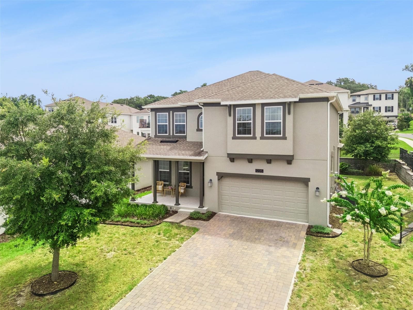 Covered front porch with welcoming entry - 1235 DORA PARC LN, MOUNT DORA