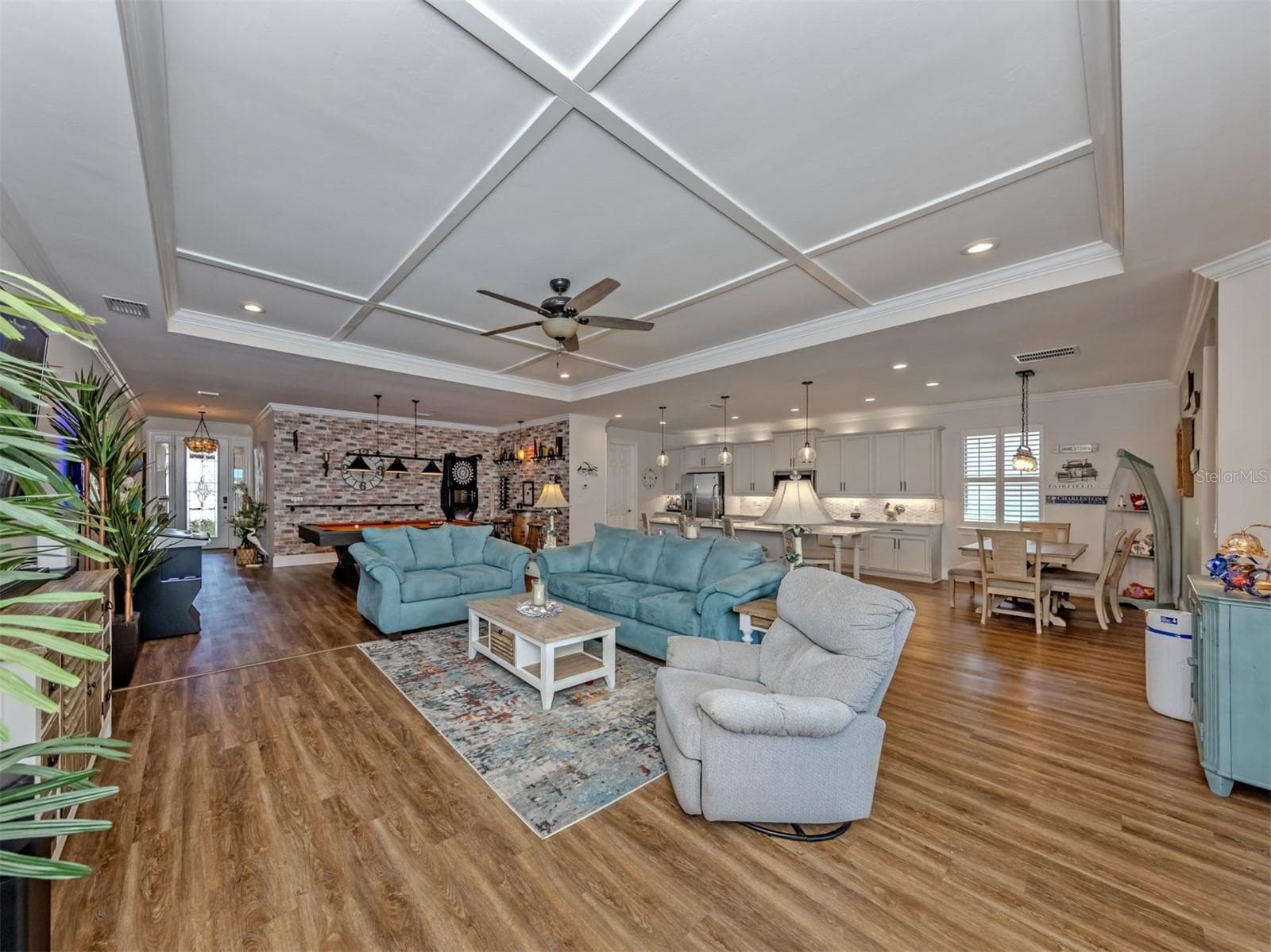 Dining room used as game room with faux brick wallpaper. - 155 TOSCAVILLA BLVD, NOKOMIS