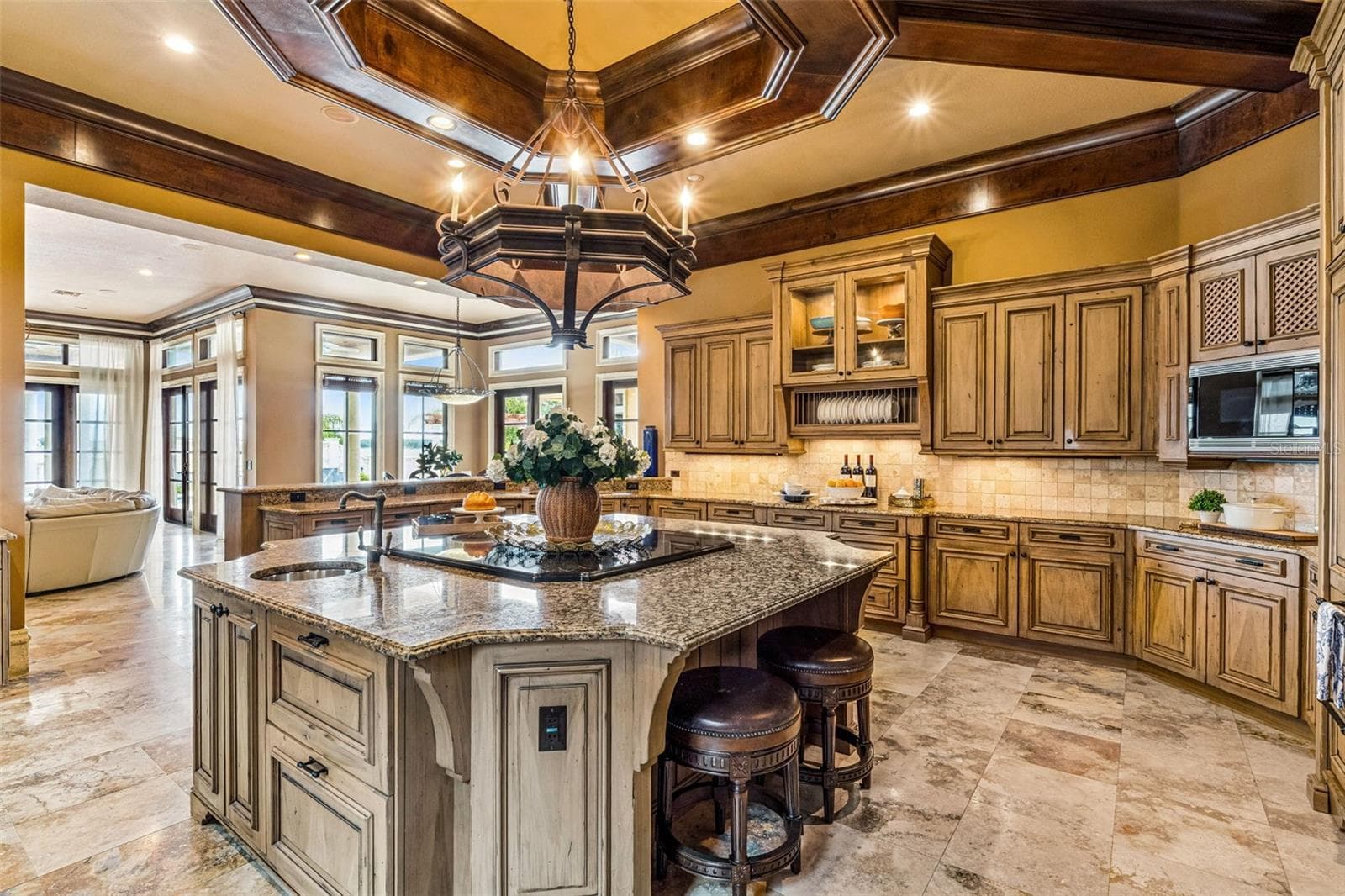 Kitchen with a grand island perfect for hosting & entertaining! - 16619 AREZO CT, MONTVERDE