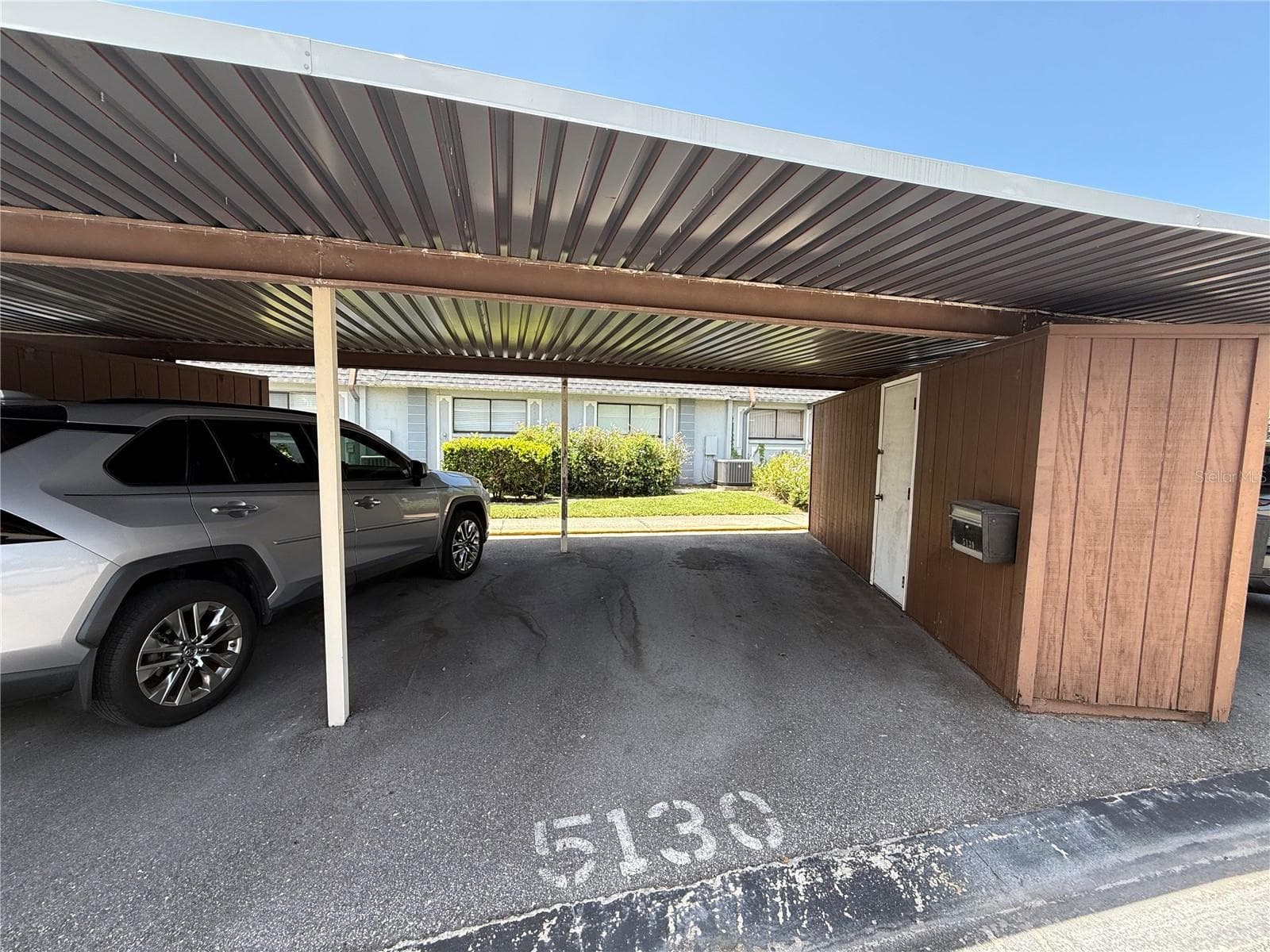 Reserved covered parking spot - 5130 70TH PL N, PINELLAS PARK