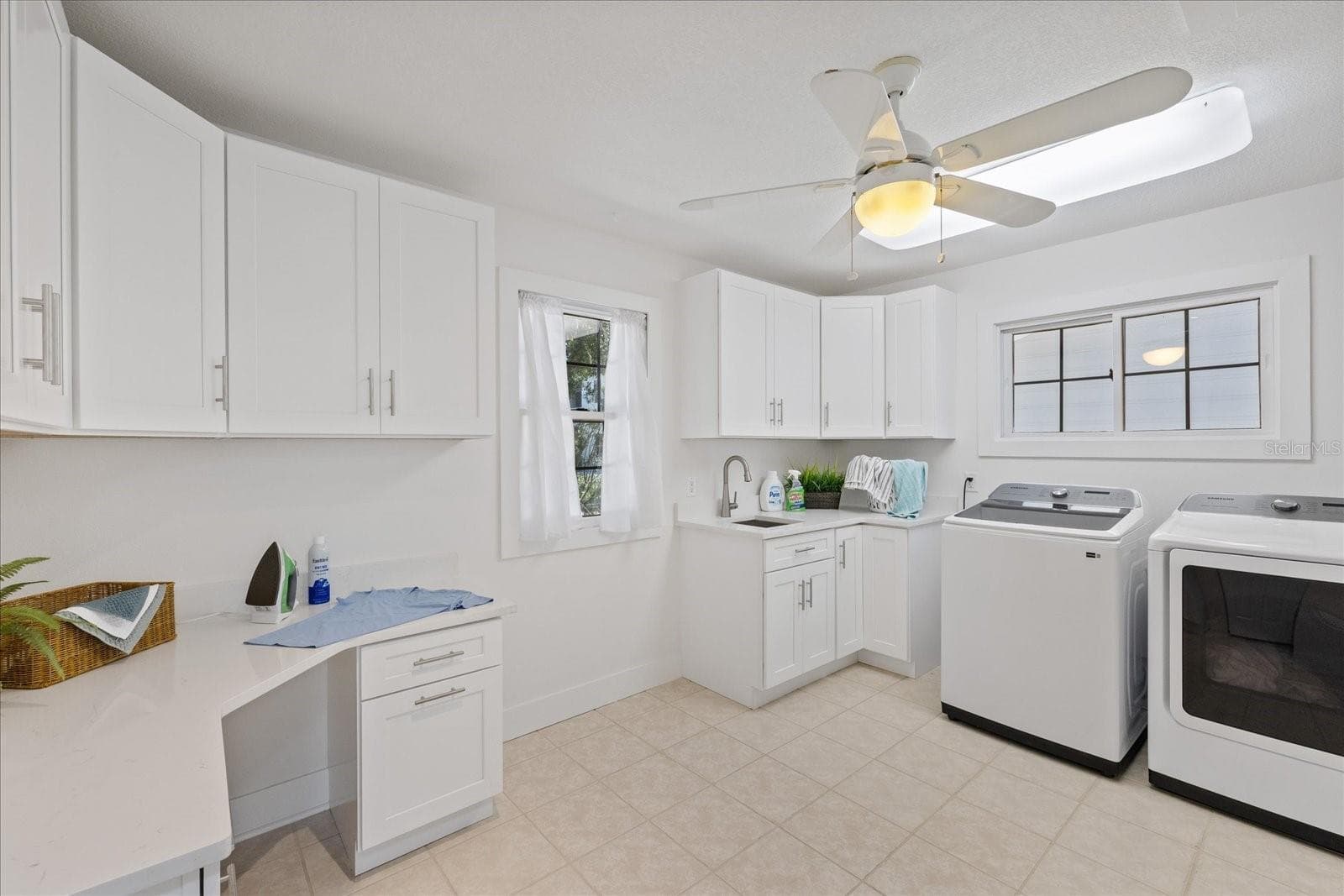 Spacious laundry room with desk and storage - 5623 HULL CT, NEW PORT RICHEY