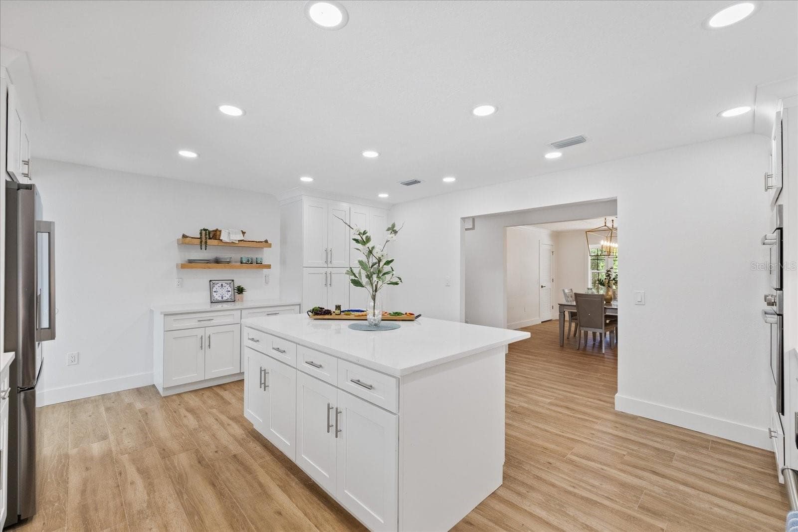 Kitchen looking to dining room from sink - 5623 HULL CT, NEW PORT RICHEY