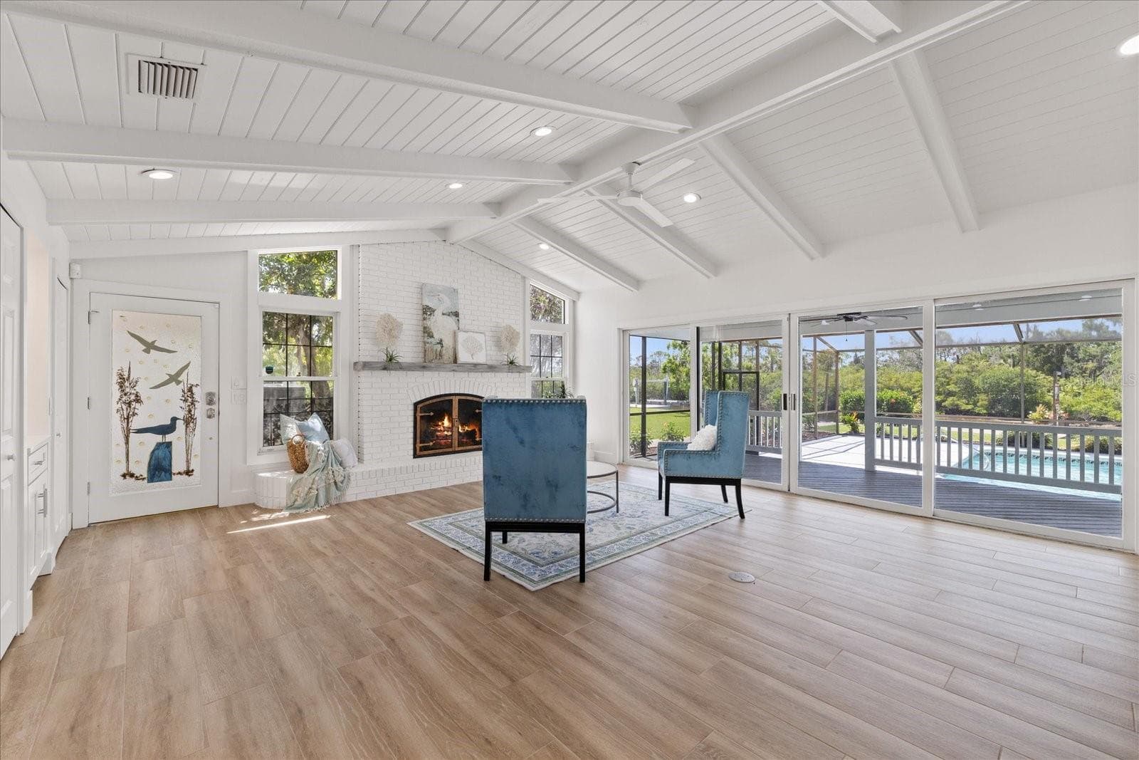 Grand living room with gas fireplace. - 5623 HULL CT, NEW PORT RICHEY