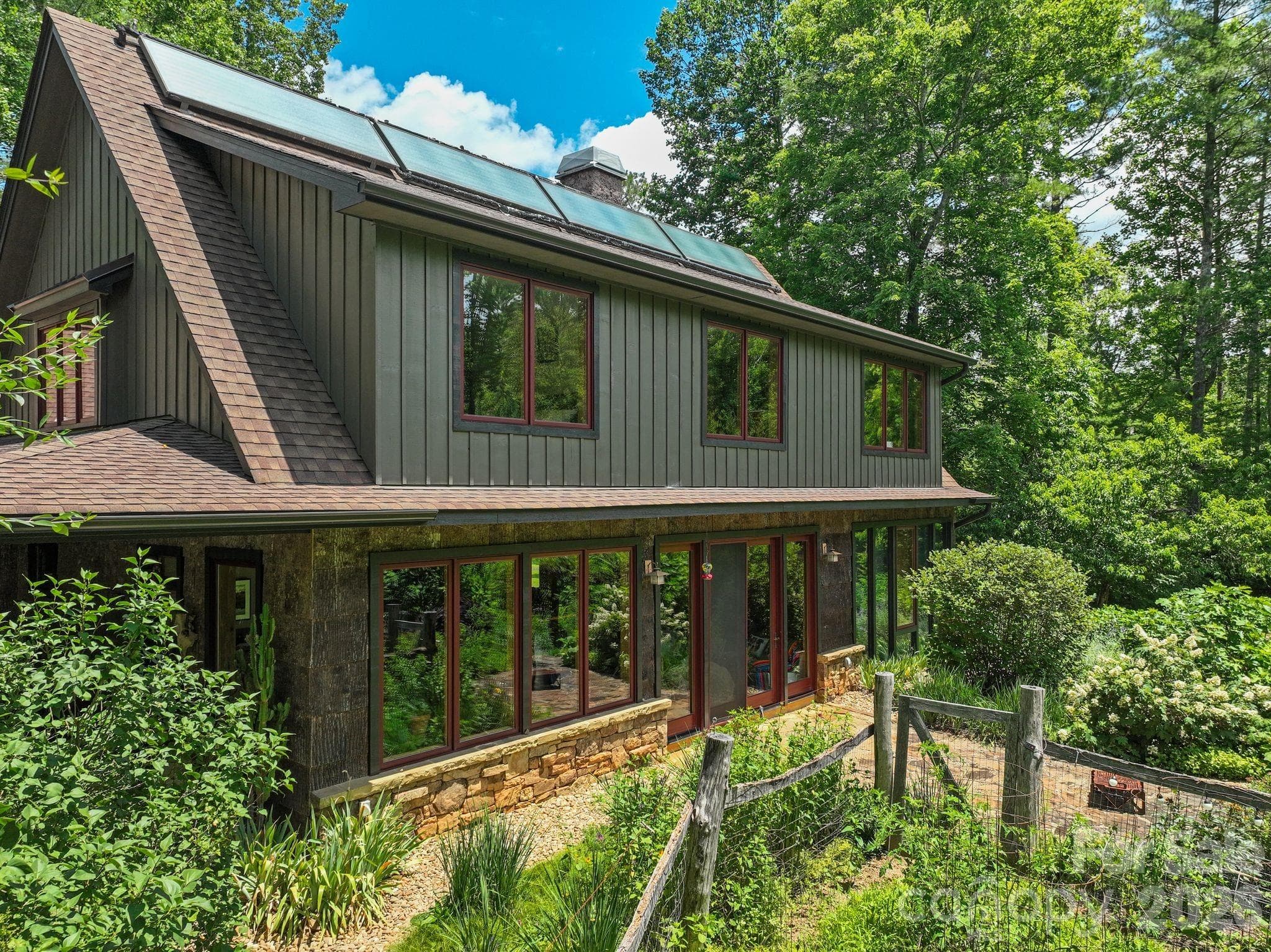 side of home with flagstone patio - 24 Merriwood Trail, Arden
