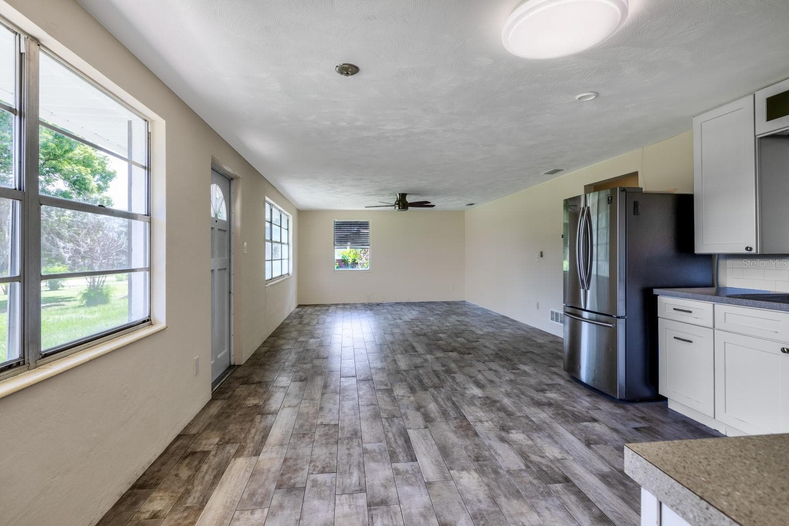 Living room from kitchen side - 5222 EAGLES NEST RD, FRUITLAND PARK