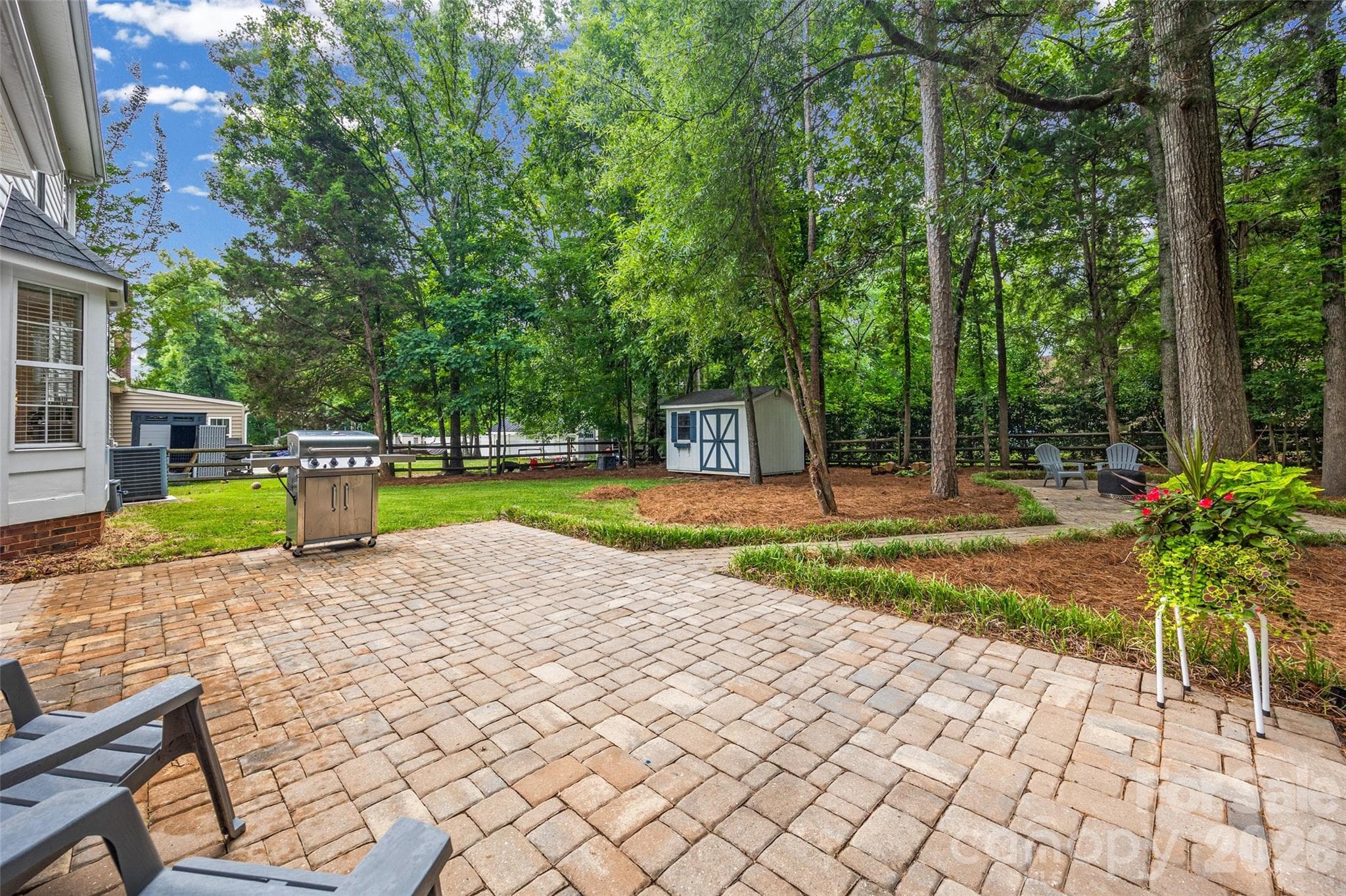 This backyard is the perfect spot for relaxing and entertaining. - Indian Trail