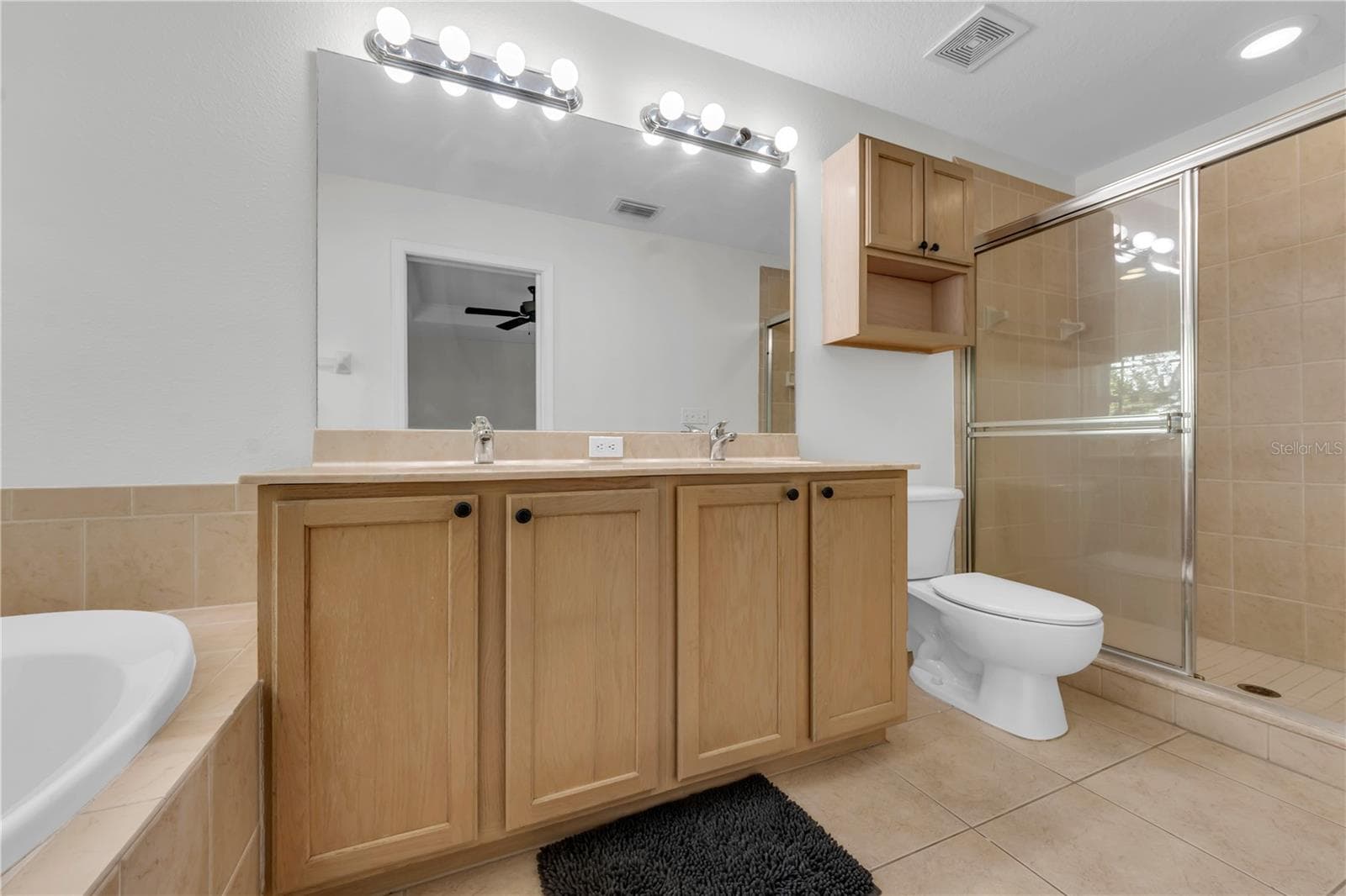MASTER BATHROOM WITH STEP IN SHOWER - 1421 RIDGE TER, TARPON SPRINGS