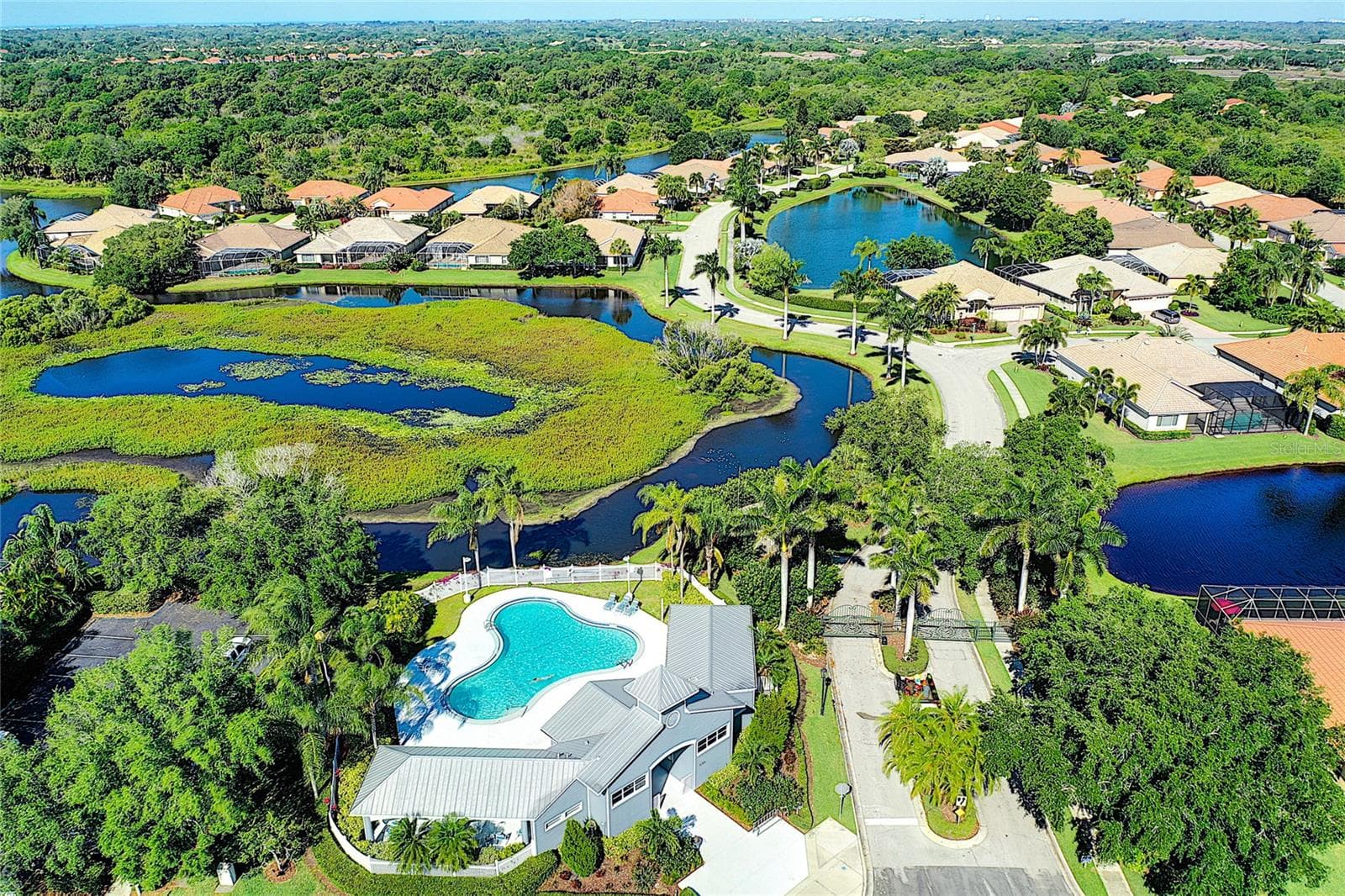 You are 3-homes down from community pool where 2x a month community socials are held. - 5133 FLAGSTONE DR, SARASOTA
